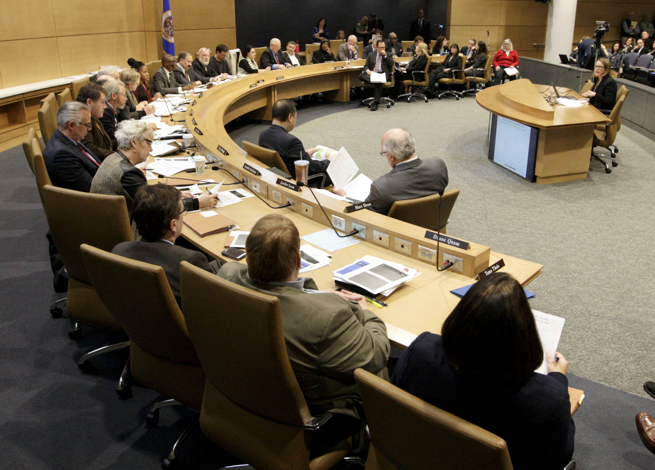 Members of the Legislative Working Group on Economic Disparities in Minnesota listen to a presentation from State Demographer Susan Brower, right, during the Jan. 7 meeting. Photo by Paul Battaglia