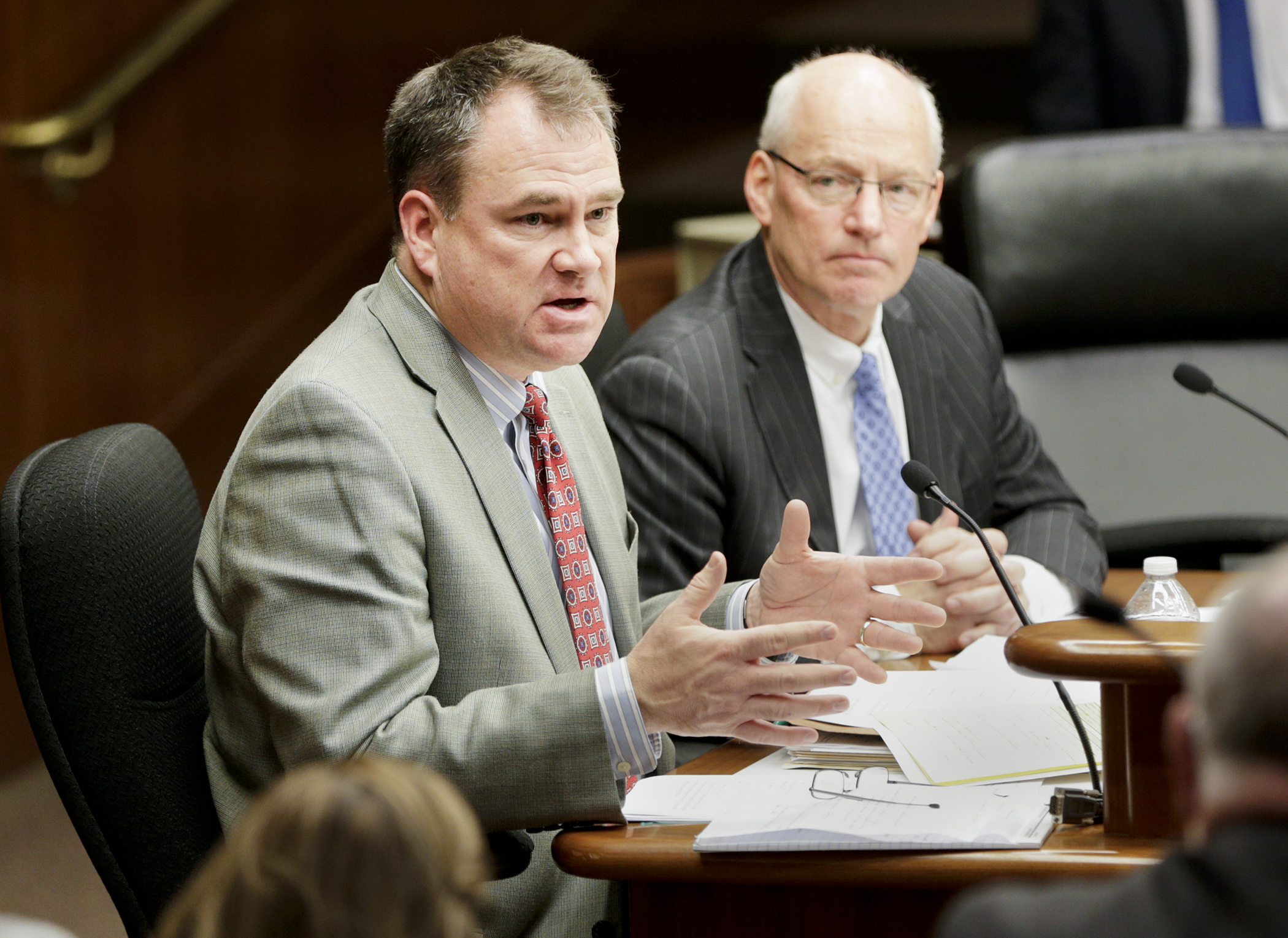 Rep. Joe Hoppe, left, makes comments to the House Commerce and Regulatory Reform Committee Jan. 10 after testimony on HF1, part of the House Republican’s health care cost relief plan. Looking on is Myron Frans, commissioner of Minnesota Management and Budget. Photo by Paul Battaglia