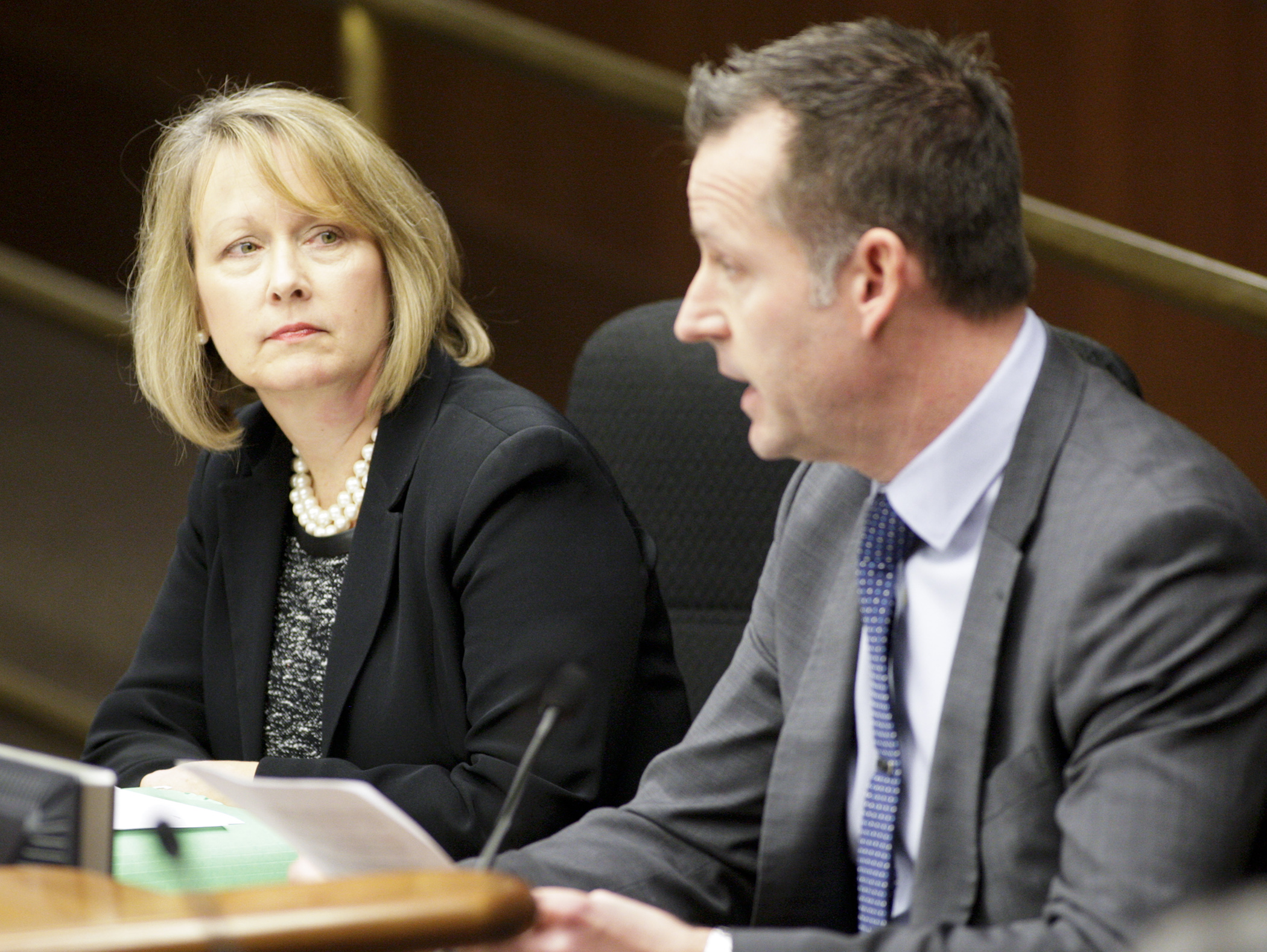 
Rep. Jenifer Loon listens during the Jan. 17 meeting of the House Commerce and Regulatory Reform Committee as Tony Chesak, executive director of the Minnesota Licensed Beverage Association, testifies against her bill HF30, which would permit Sunday liquors sales. Photo by Paul Battaglia