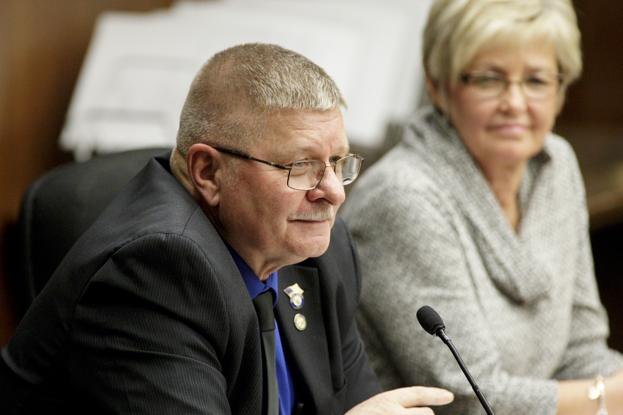 Rep. Dale Lueck offers a comment Jan. 18 to the House Taxes Committee about a bill he sponsors, HF9, which would phase out the state tax on Social Security benefits. Rep. Kathy Lohmer, right, sponsors a similar bill, HF213. Photo by Paul Battaglia