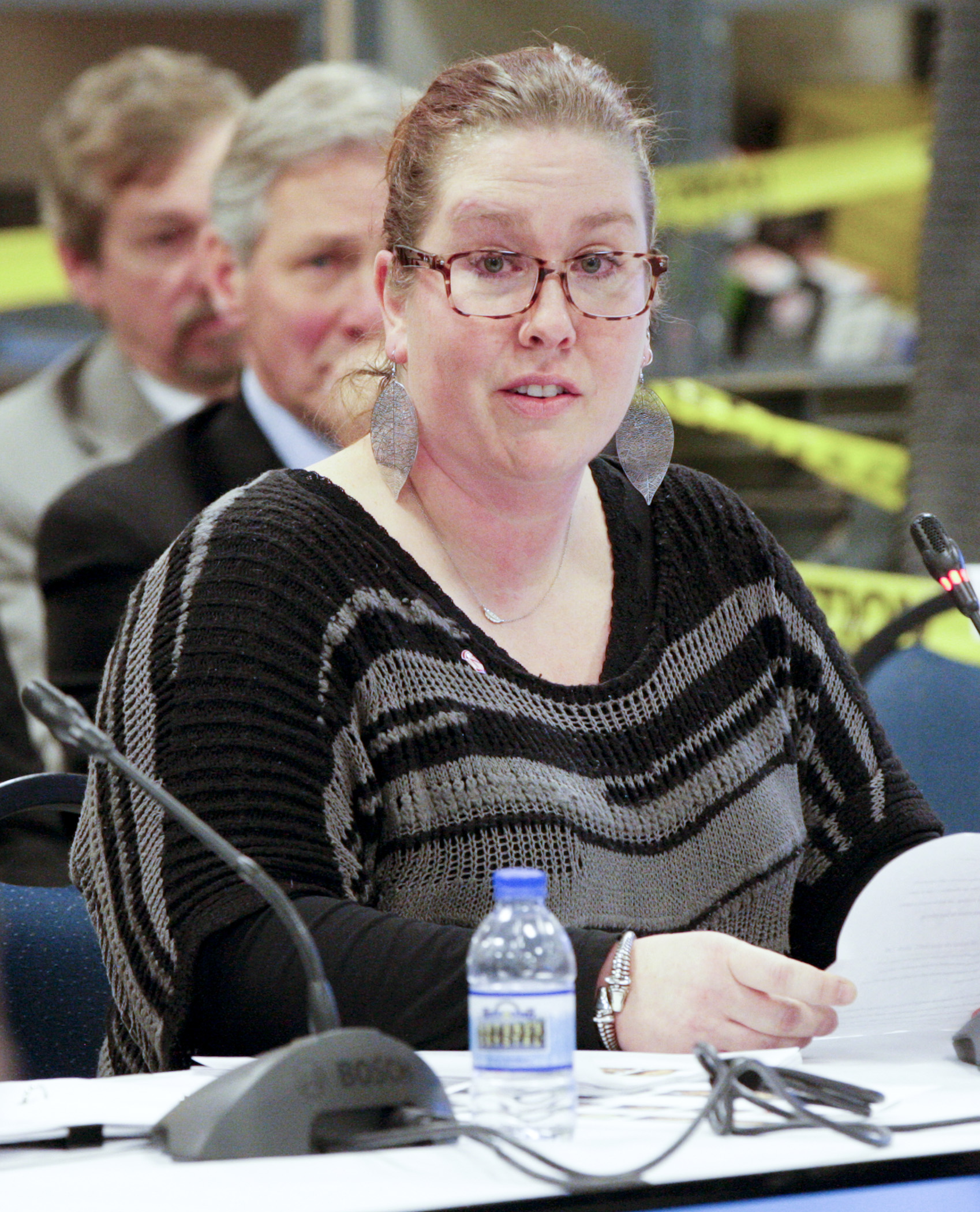 Normandale Community College student Heather Christopher tells members of the House Higher Education Policy and Finance Committee her personal story during a committee hearing held at Saint Paul College Jan. 21. Photo by Paul Battaglia