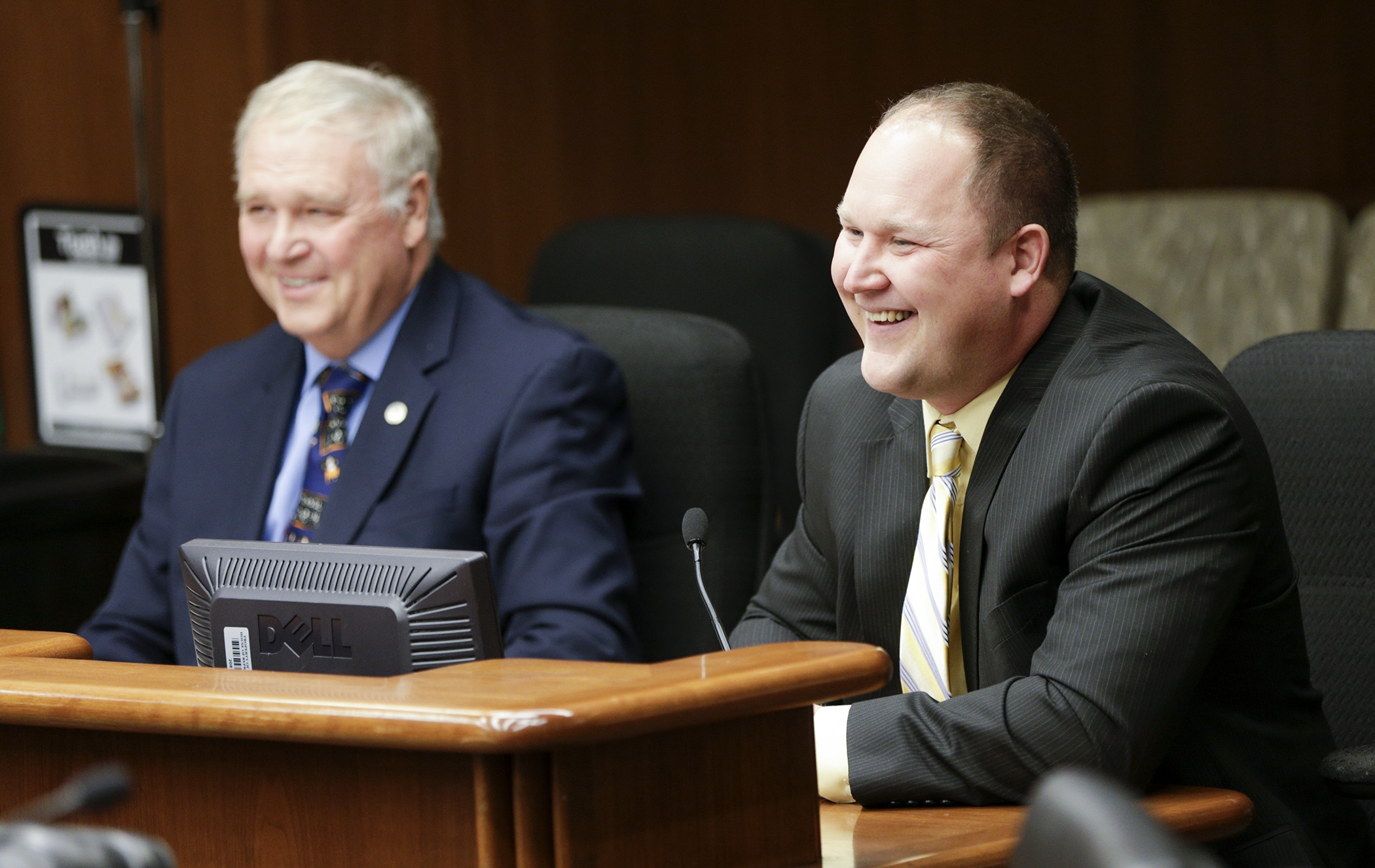 Troy Urdahl, right, testifies in favor of HF301, sponsored by his father, Rep. Dean Urdahl, left which would give a ticket and admission exemption for Minnesota State High School League events. Photo by Paul Battaglia