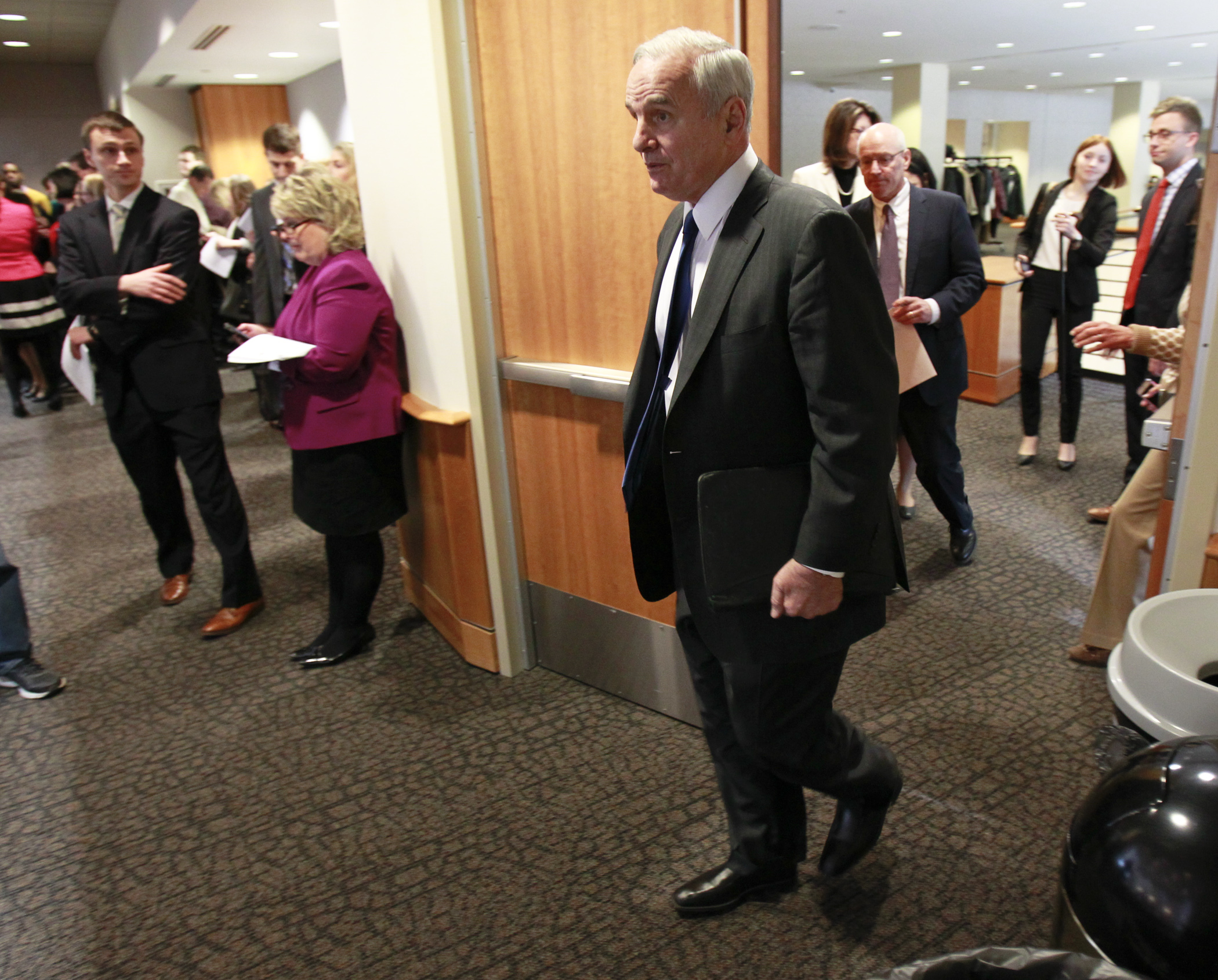 Gov. Mark Dayton enters the room to deliver his biennial budget proposal Jan. 27. Photo by Paul Battaglia