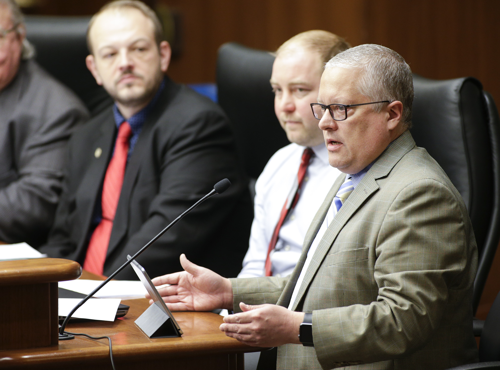 Scott Carlson, executive director of the Farmers’ Legal Action Group, testifies Jan. 31 on HF158, sponsored by Rep. Jeff Brand, left, which would provide funding for the nonprofit organization. Photo by Paul Battaglia