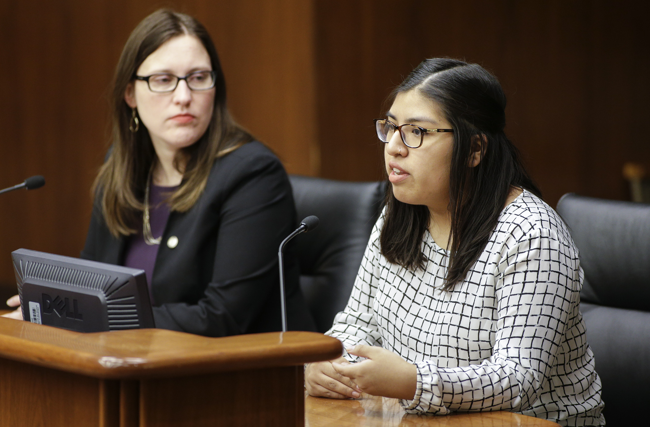 Catalina Anampa Castro, chair of the University of Minnesota Student Senate, testifies Feb. 5 in support of a Rep. Jamie Becker-Finn, left, bill to make refundable a tax credit for payments of student loan principal and interest. Photo by Paul Battaglia