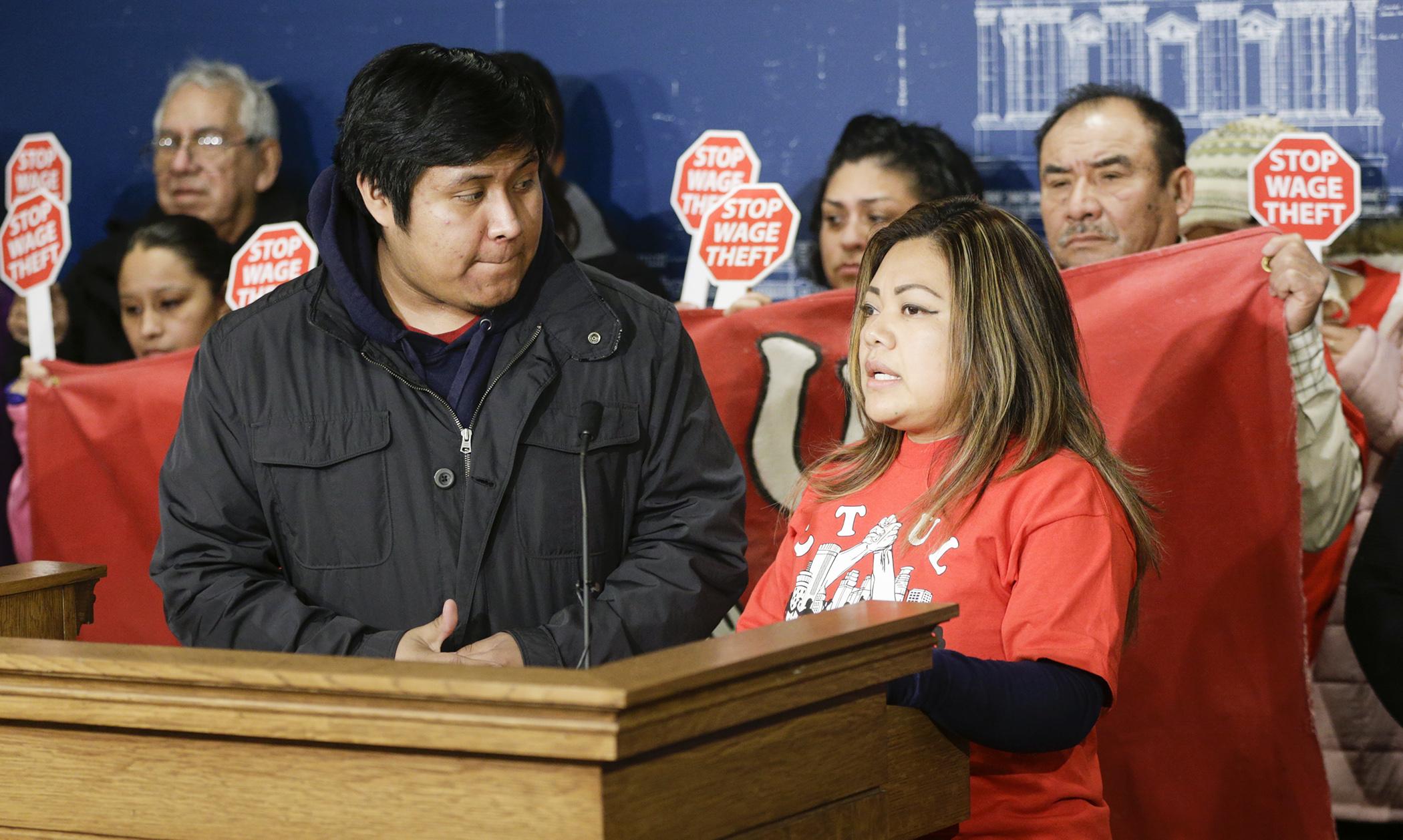 Cecilia Guzman, right, speaks at a news conference Wednesday about having her wages stolen at a former job. The House Labor Committee later heard and approved a bill that would prohibit wage theft. Photo by Paul Battaglia