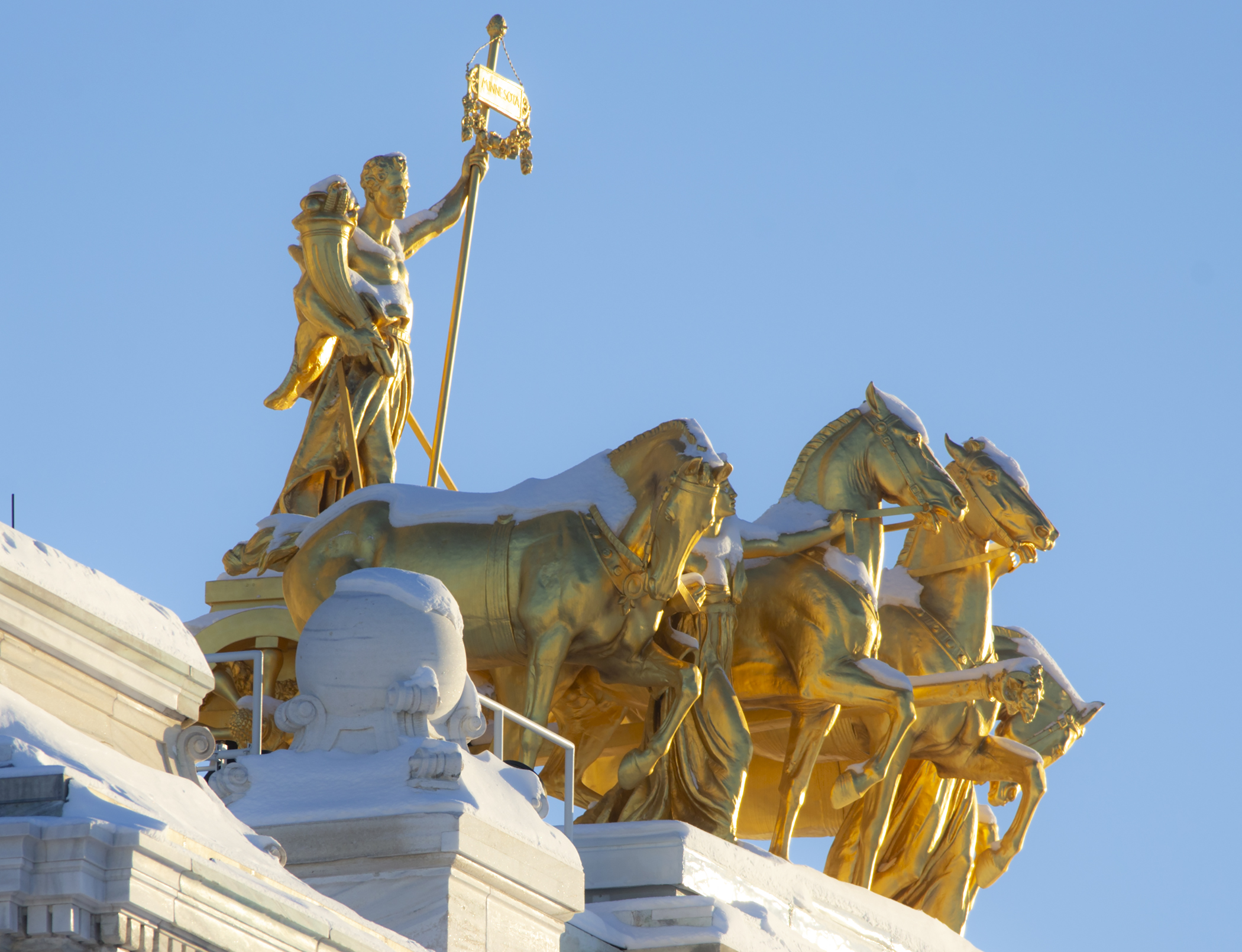Snow rests atop the Quadriga at the base of the Capitol Dome February 14.  Photo by Paul Battaglia