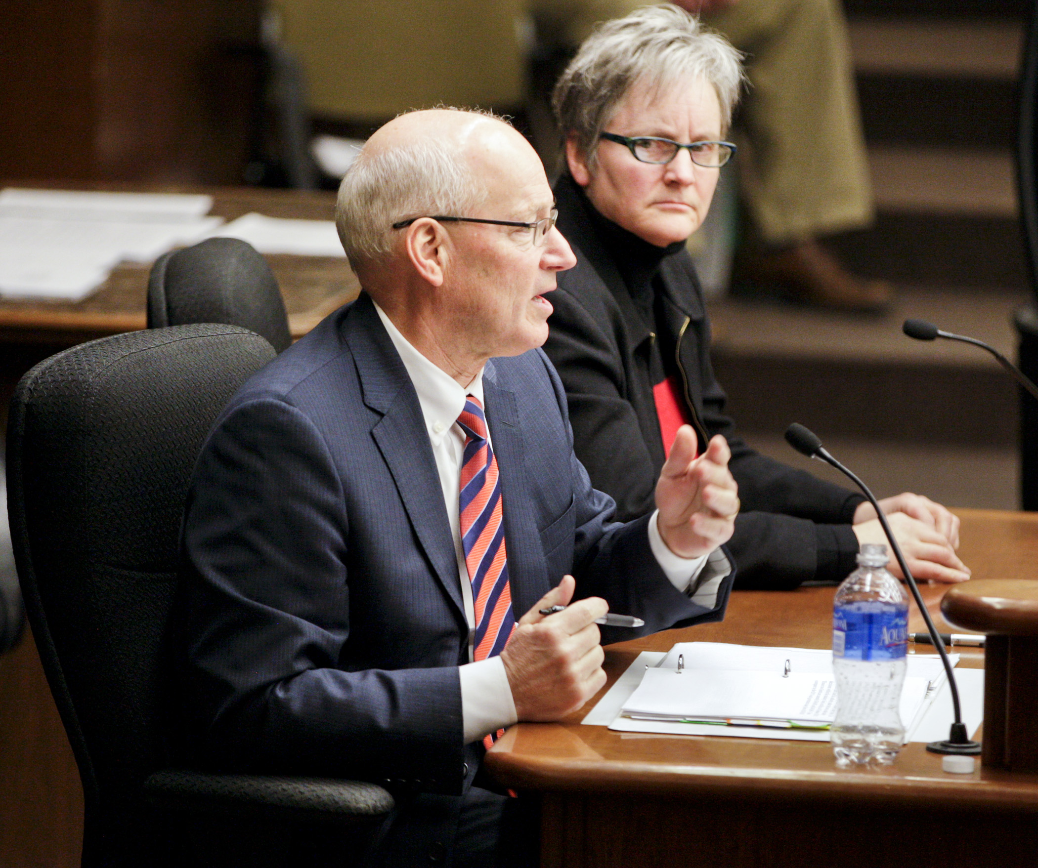 Minnesota Management & Budget Commissioner Myron Frans answers a members question during testimony before the House State Government Finance Committee Feb. 12. Seated with him is State Budget Director Margaret Kelly. Photo by Paul Battaglia