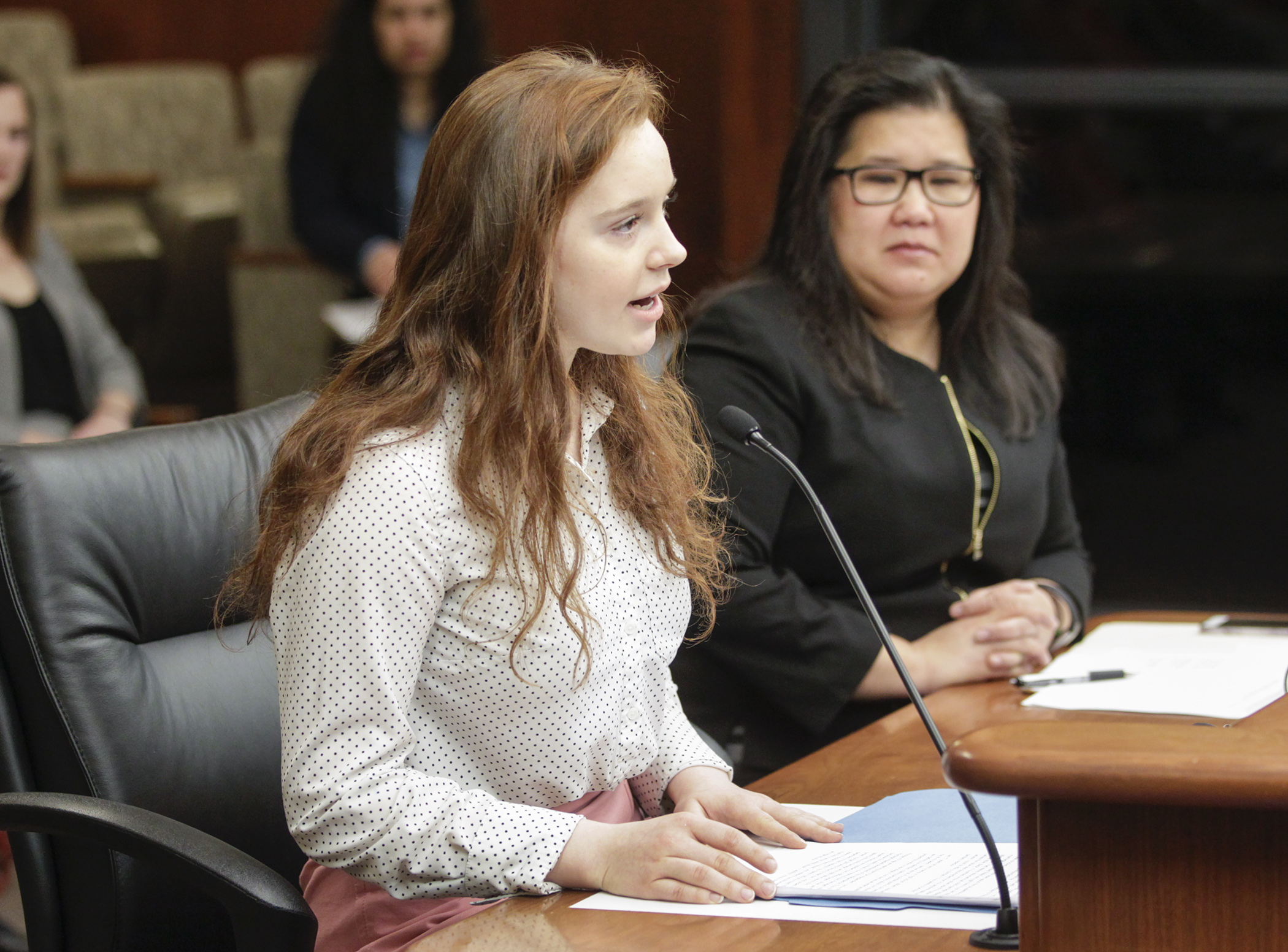 High school student Chloe Morse testifies in the House Judiciary Finance and Civil Law Division in favor of HF745, sponsored by Rep. Kaohly Her, right, which would remove legal provisions that allow minors to marry in Minnesota. Photo by Paul Battaglia
