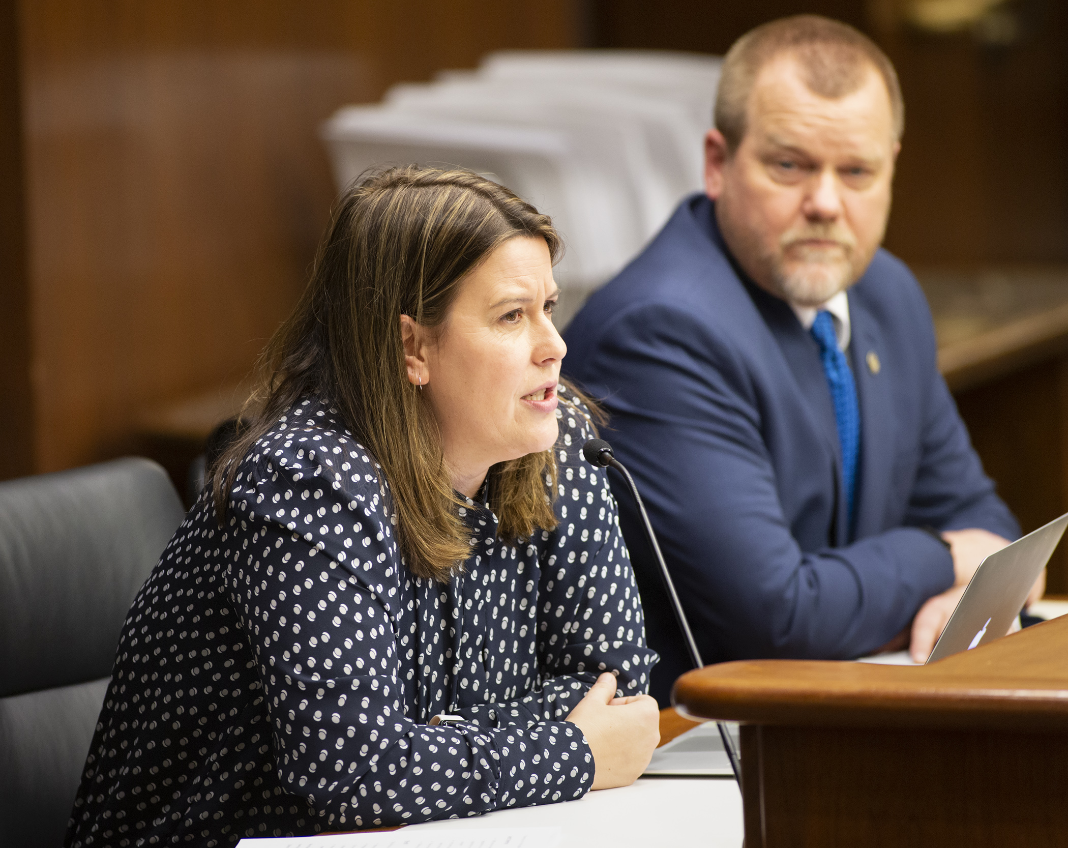 Jessica Webster, Legal Aid staff attorney, testifies before the House Education Policy Committee on HF55, sponsored by Rep. Tony Jurgens, right, which would, in part, work to prohibit the practice of so-called “lunch shaming.” Photo by Paul Battaglia