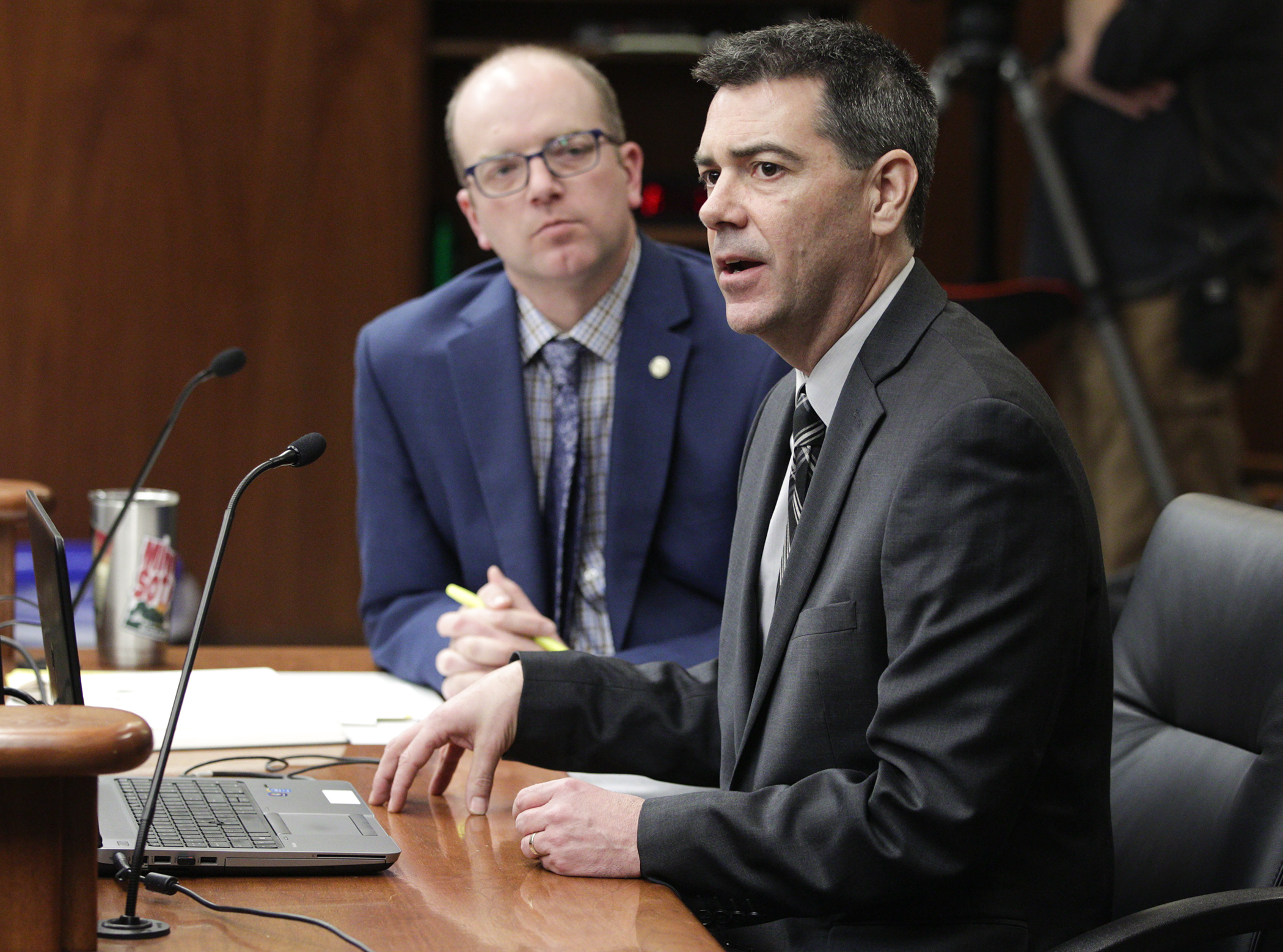 Judd Schetnan, Metropolitan Council government affairs director, answers a question during testimony in the House Transportation Finance and Policy Division Feb. 20 on HF3085, sponsored by Rep. Brad Tabke, right. Photo by Paul Battaglia