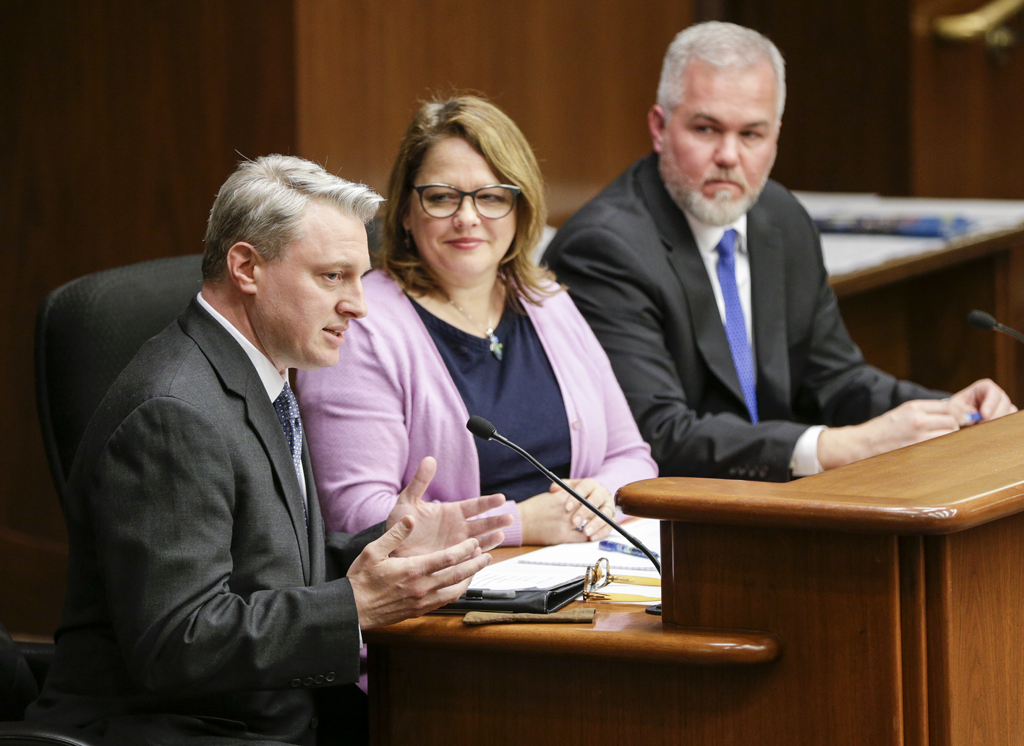 Irondale High School teacher Rich Rosivach discusses HF1067, sponsored by Rep. Connie Bernardy, center, with the House Higher Education and Career Readiness Policy and Finance Committee Feb. 21. The bill would, in part, establish a training program to help secondary teachers meet the licensing requirements for concurrent enrollment courses. Photo by Paul Battaglia