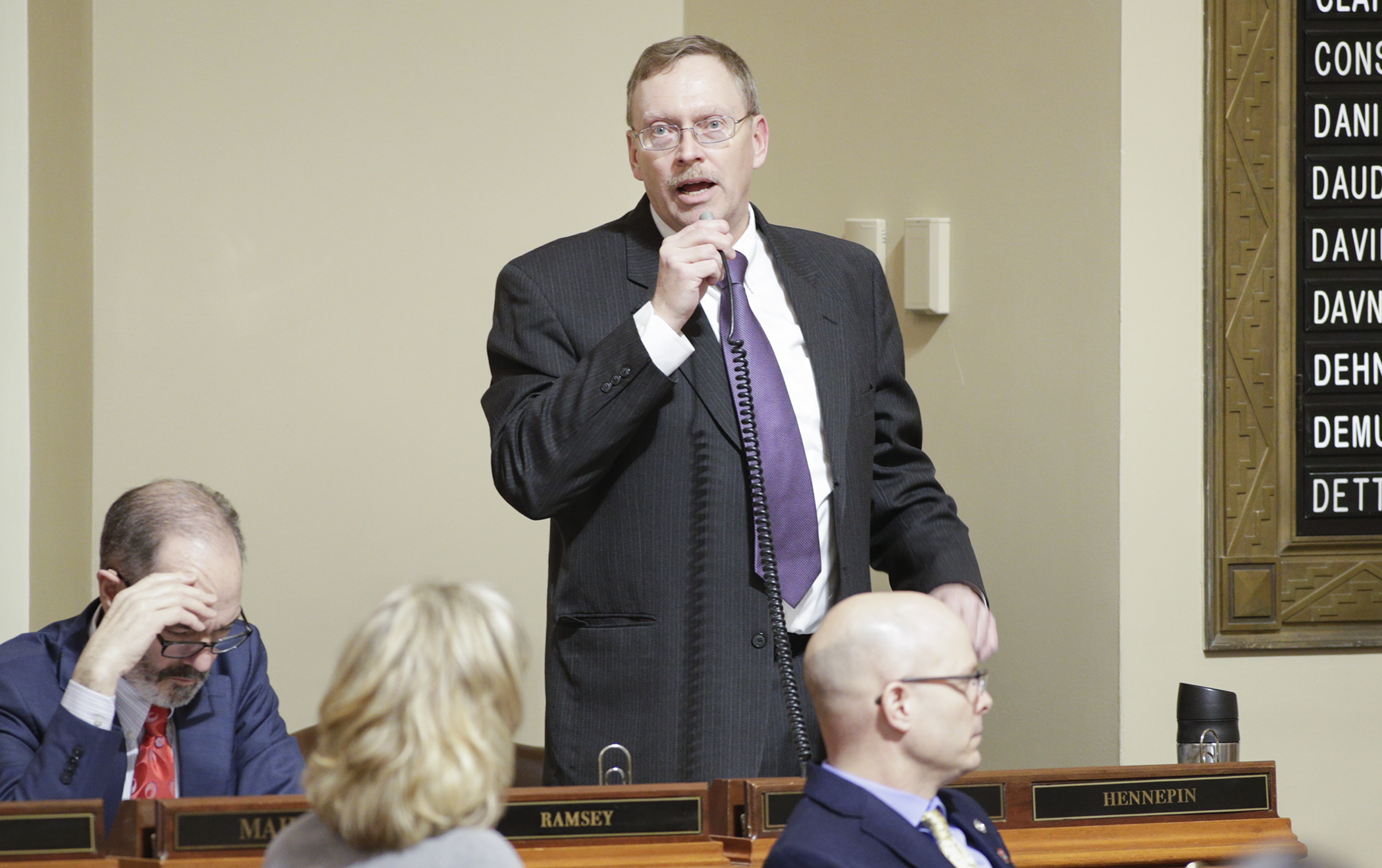 Rep. Michael Nelson describes his bill HF14, which would appropriate funds to the secretary of state to support efforts to secure elections infrastructure against cybersecurity threats, during floor debate Feb. 21. Photo by Paul Battaglia