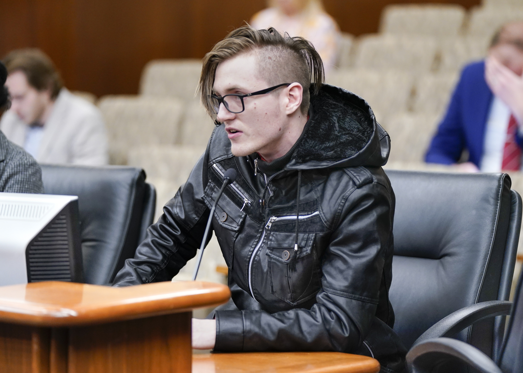 SEIU nursing home worker Travis Burth testifies before the House Labor and Industry Finance and Policy Committee Feb. 21 in support of HF908, a bill to establish a Nursing Home Workforce Standards Board. (Photo by Catherine Davis)