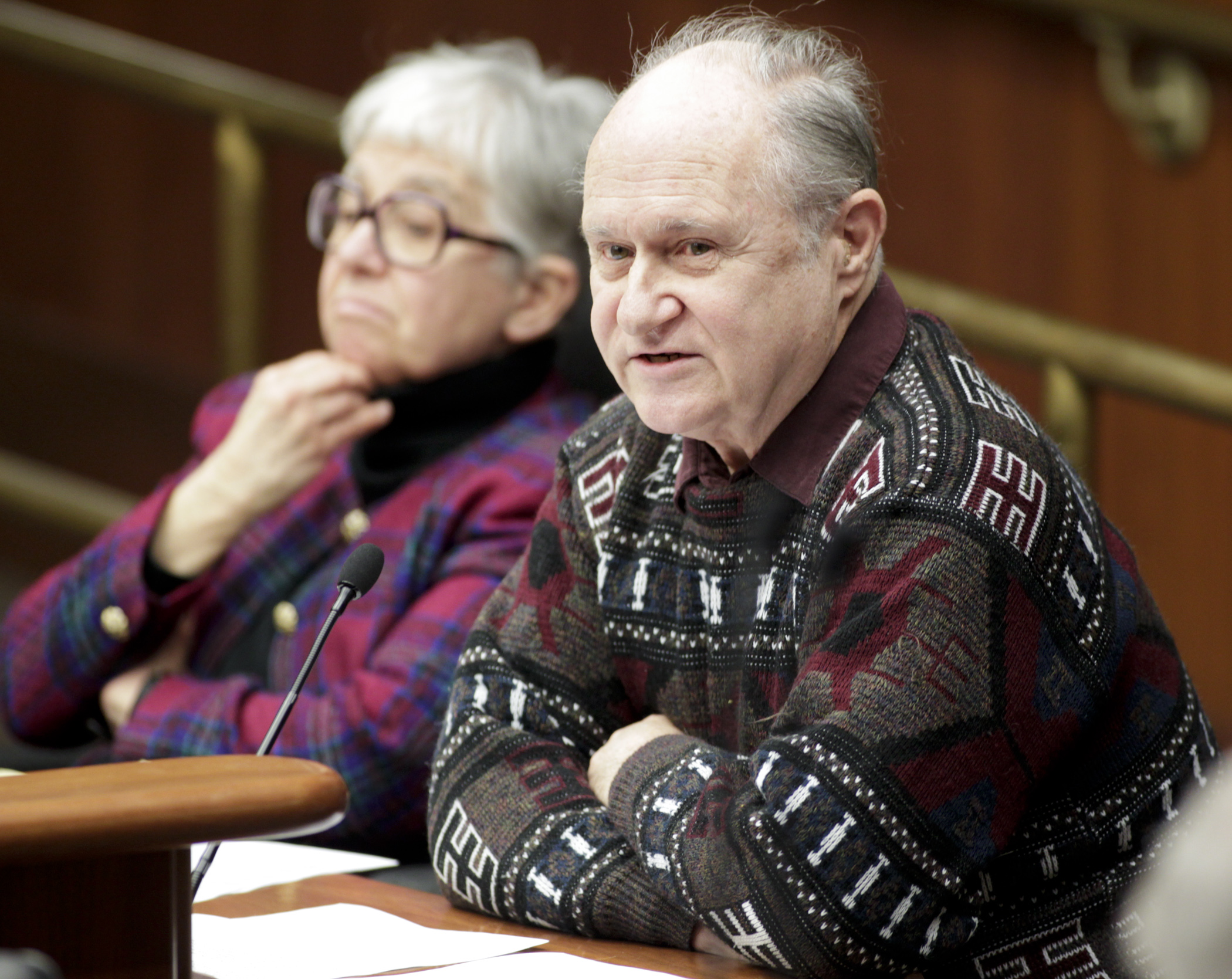 Chuck Boody, conductor of the Minnesota State Band, testifies on HF19 sponsored by Rep. Phyllis Kahn, left, which would provide funding for the band. Photo by Paul Battaglia