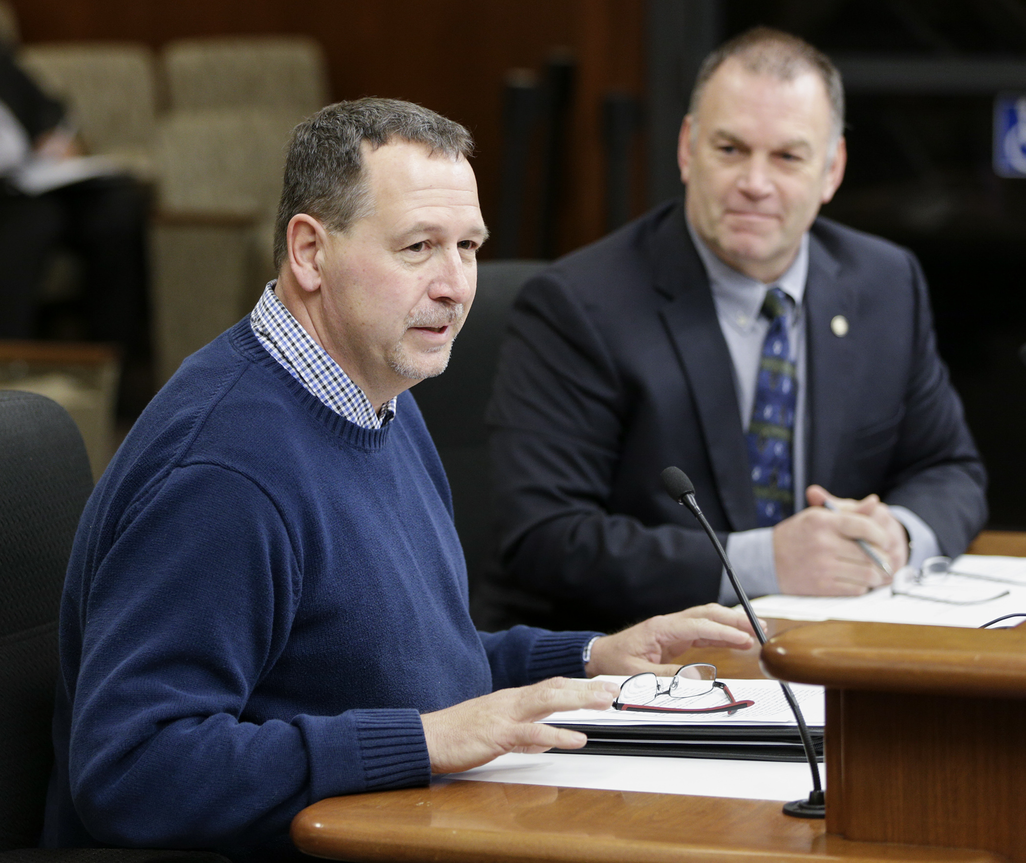 John Thomas, transportation manager for Eastern Carver County Schools, relates his experience with propane school buses to the House Education Innovation Policy Committee during testimony on HF1254, sponsored by Rep. Dave Baker, right, which would in part establish a propane school bus and fueling station rebate program. Photo by Paul Battaglia