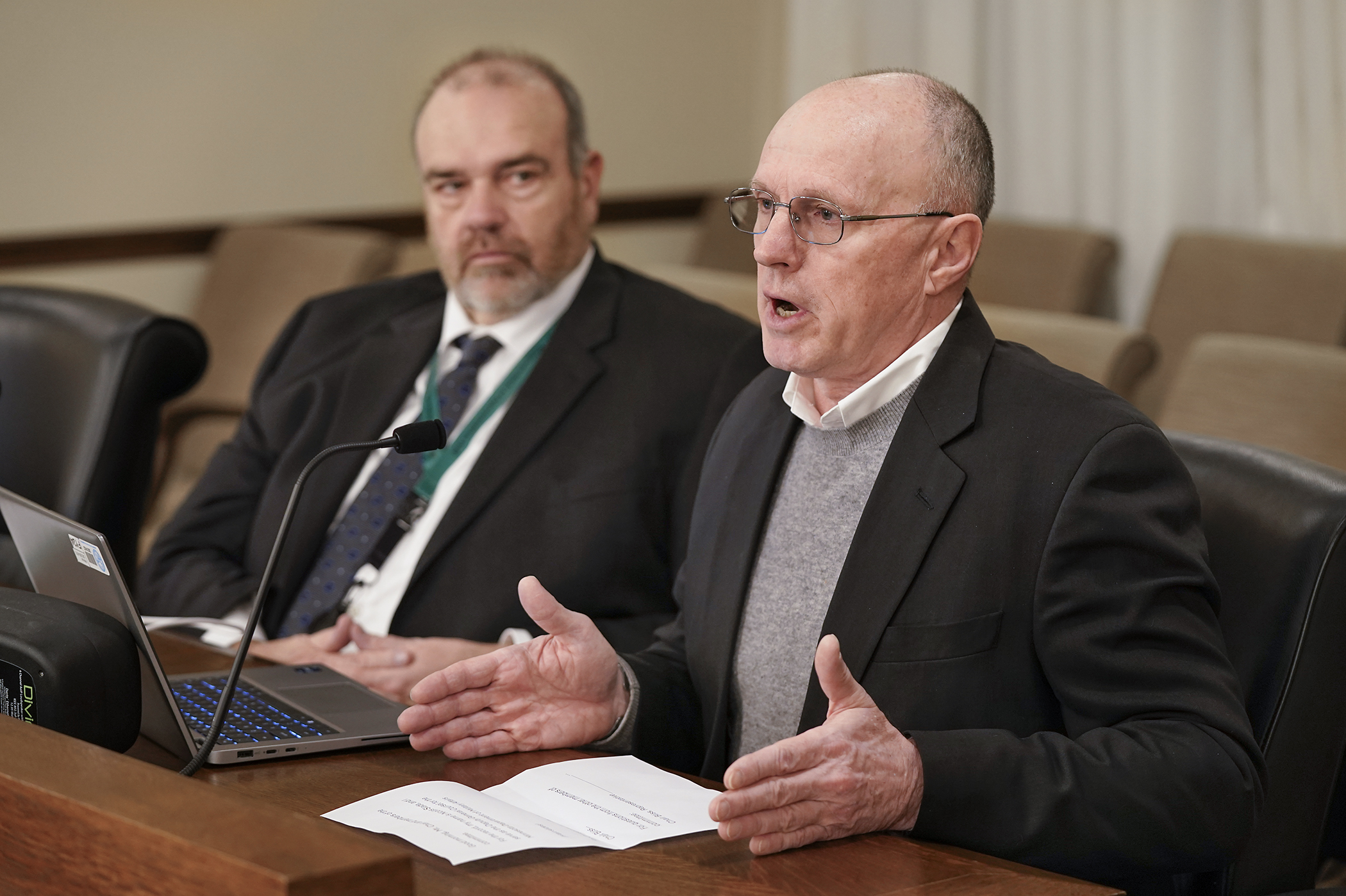 Nicholas Slade, deputy general counsel at the Department of Military Affairs, speaks in support of HF3540 to add “veteran and military status” to the state’s Human Rights Act. The bill is sponsored by Rep. Matt Bliss, left. (Photo by Michele Jokinen)