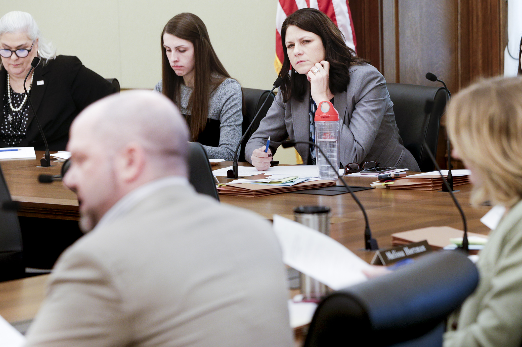 House Majority Leader Joyce Peppin, center, listens as Rep. Mike Freiberg, left, asks a question Feb. 26 during the first meeting of the House Subcommittee on Workplace Safety and Respect. Photo by Paul Battaglia