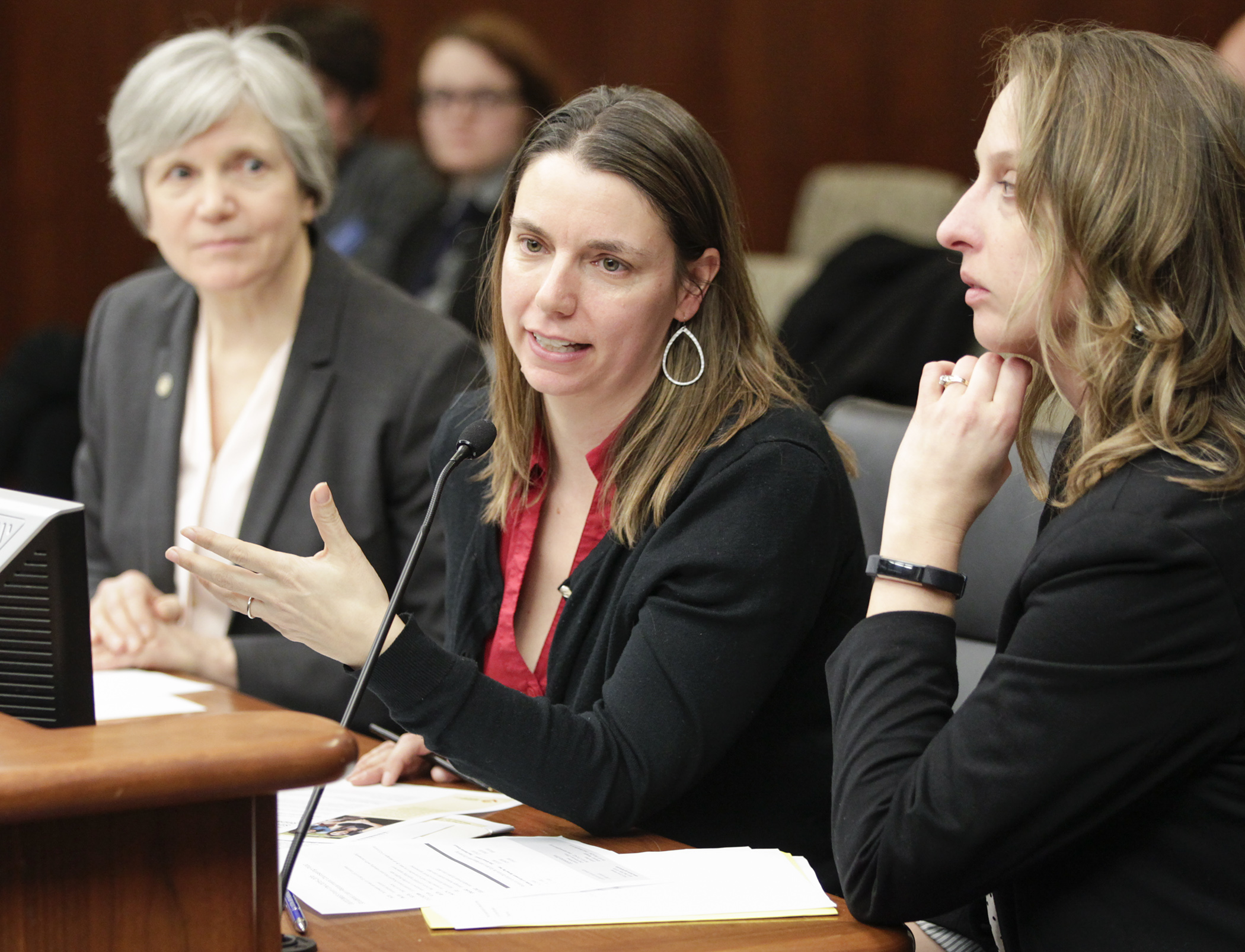 Juliana Keen, advocacy manager with Lutheran Social Service of Minnesota, testifies before the House Higher Education Finance and Policy Division on a bill sponsored by Rep. Laurie Pryor, left, that deals with student loan debt counseling. Photo by Paul Battaglia