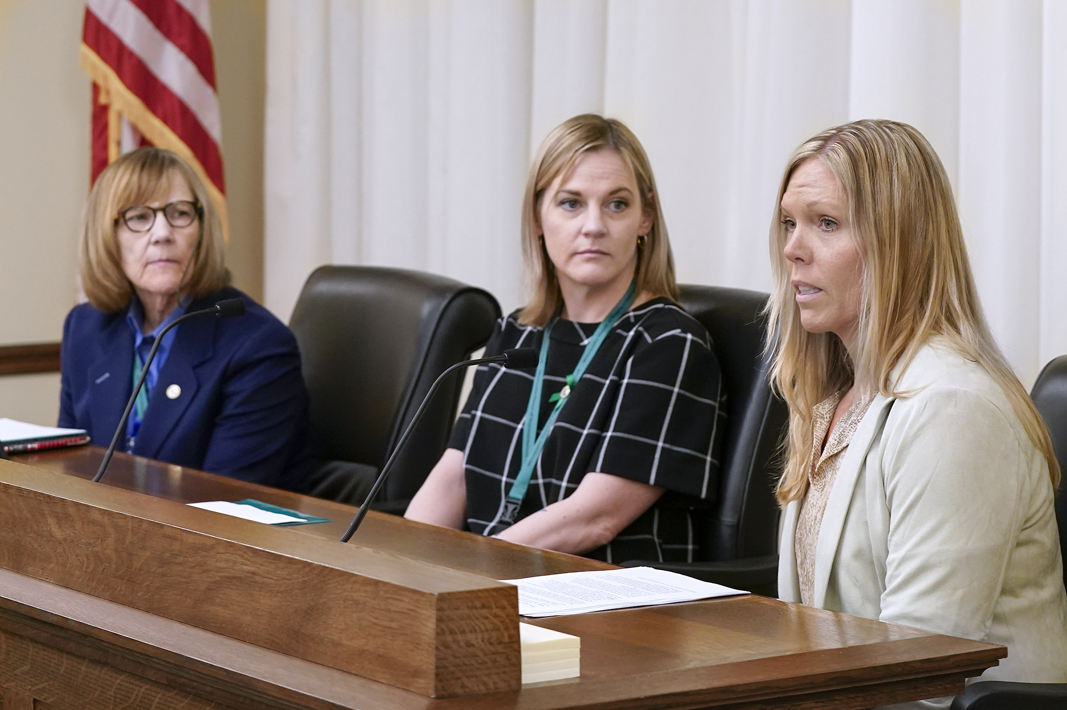 Lynn Lawrence, a detective with the Woodbury Public Safety Department, testifies Feb. 26 in support of HF3642. Sponsored by Rep. Erin Koegel, center, the bill would prohibit virtual cryptocurrency kiosks. (Photo by Michele Jokinen)