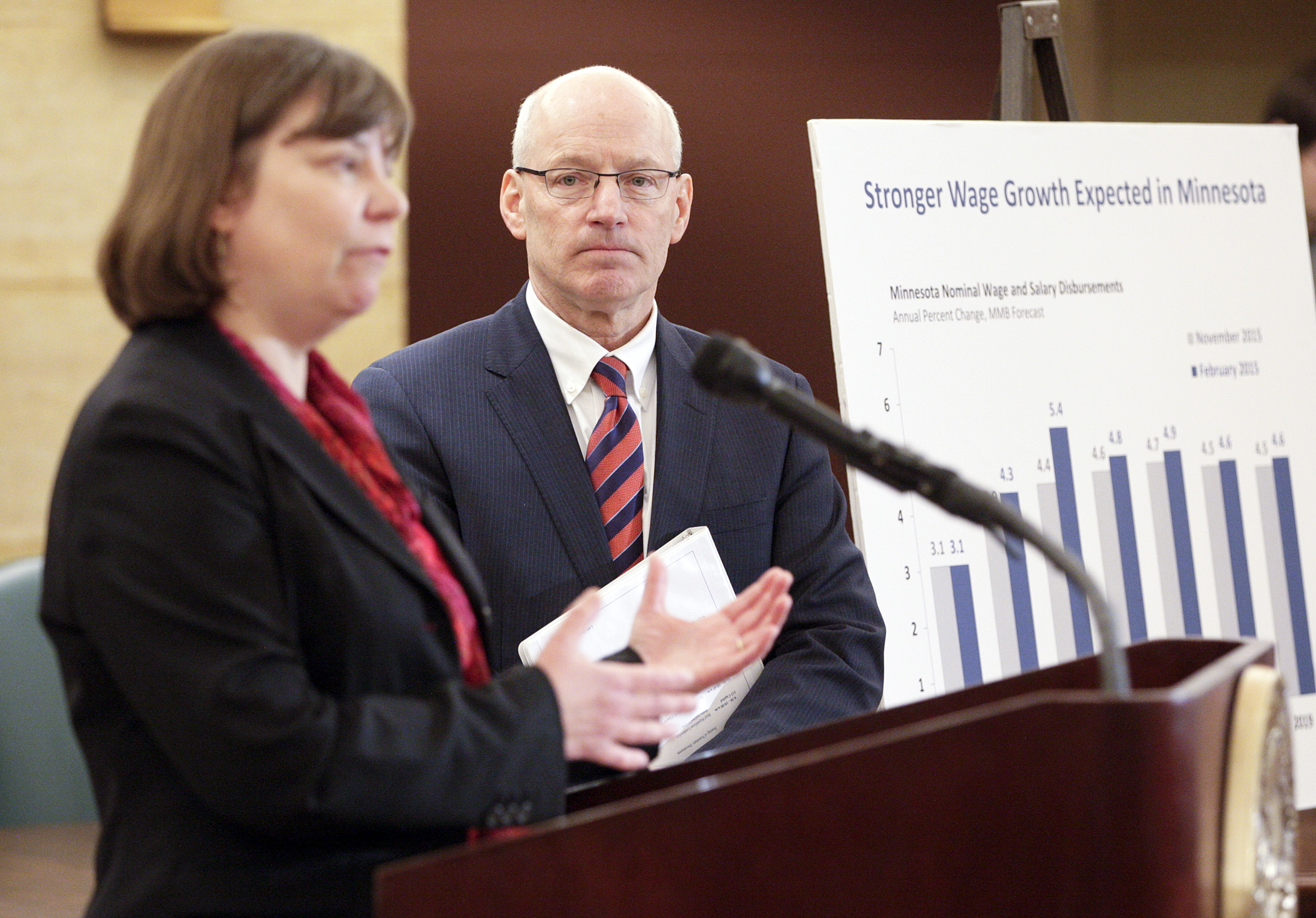 Minnesota Management & Budget Commissioner Myron Frans, right, looks on as State Economist Laura Kalambokidis answers a question during a Feb. 27 press conference on the February Budget and Economic Forecast. The state is now expected to have a nearly $1.87 billion surplus over the next biennium. Photo by Paul Battaglia
