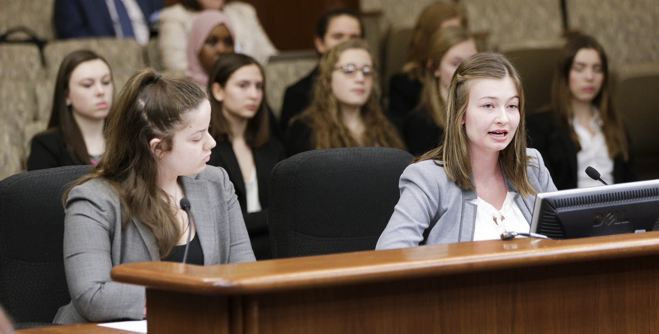Jessica Melnik, right, a Hopkins High School junior and president of Girls United MN, testifies on HF2768, which would, in part, allow school districts to include sexual exploitation prevention instruction in a health curriculum. Photo by Paul Battaglia