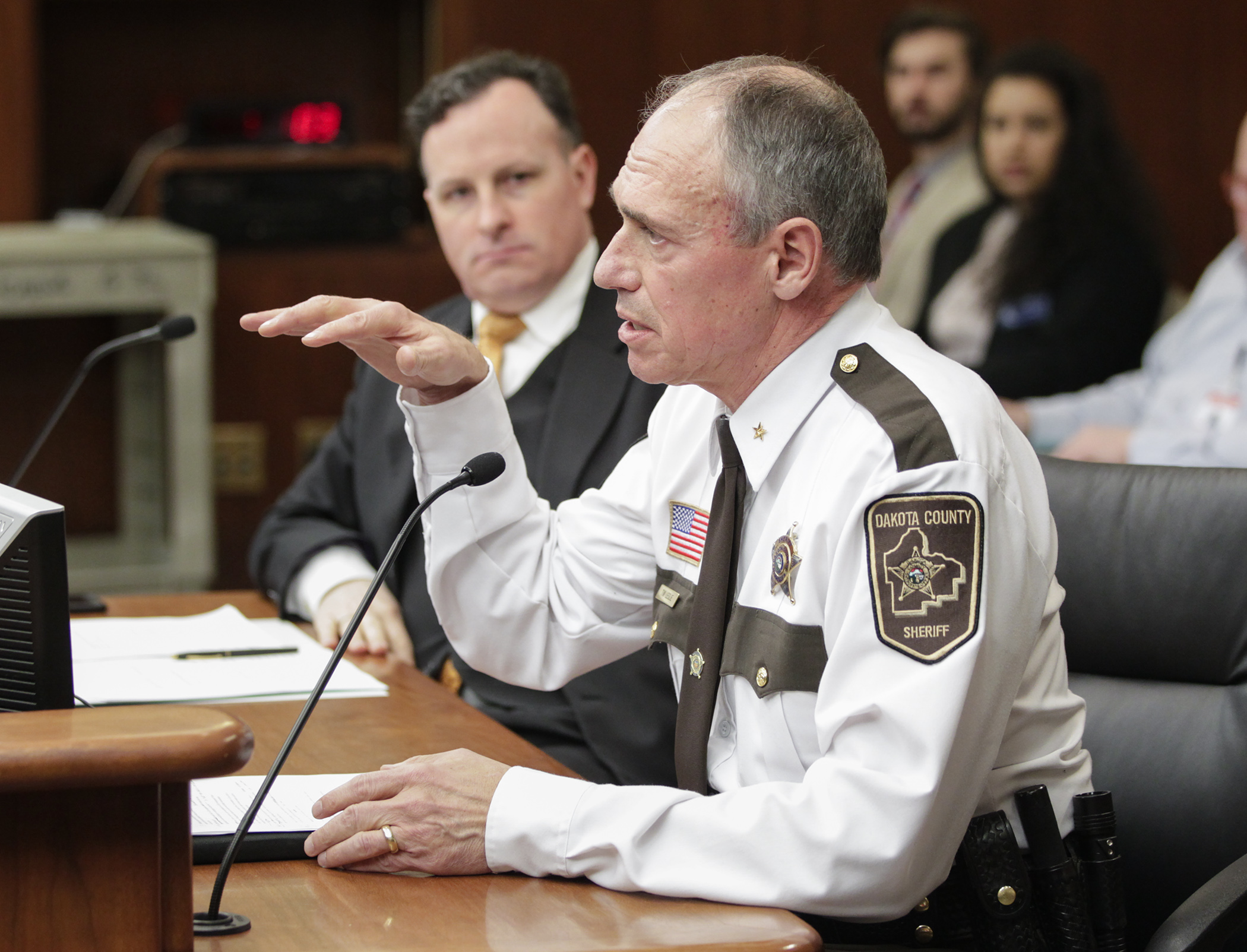 Dakota County Sheriff Tim Leslie testifies on HF1236, sponsored by Rep. John Lesch, left, which would restrict the use of unmanned aerial vehicles (drones) by law enforcement agencies. Photo by Paul Battaglia