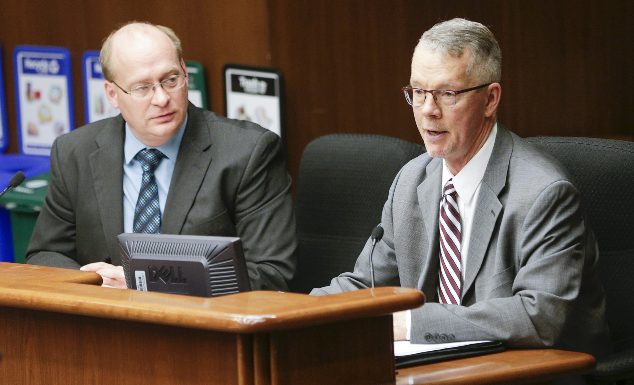 Loren Laugtug, manager of legislative affairs for Otter Tail Power Company, testifies Feb. 28 before the House Taxes Committee in favor of HF2421, sponsored by Rep. Jeff Backer, left, which would expand the sales tax exemption for purchases of electricity. Photo by Paul Battaglia

