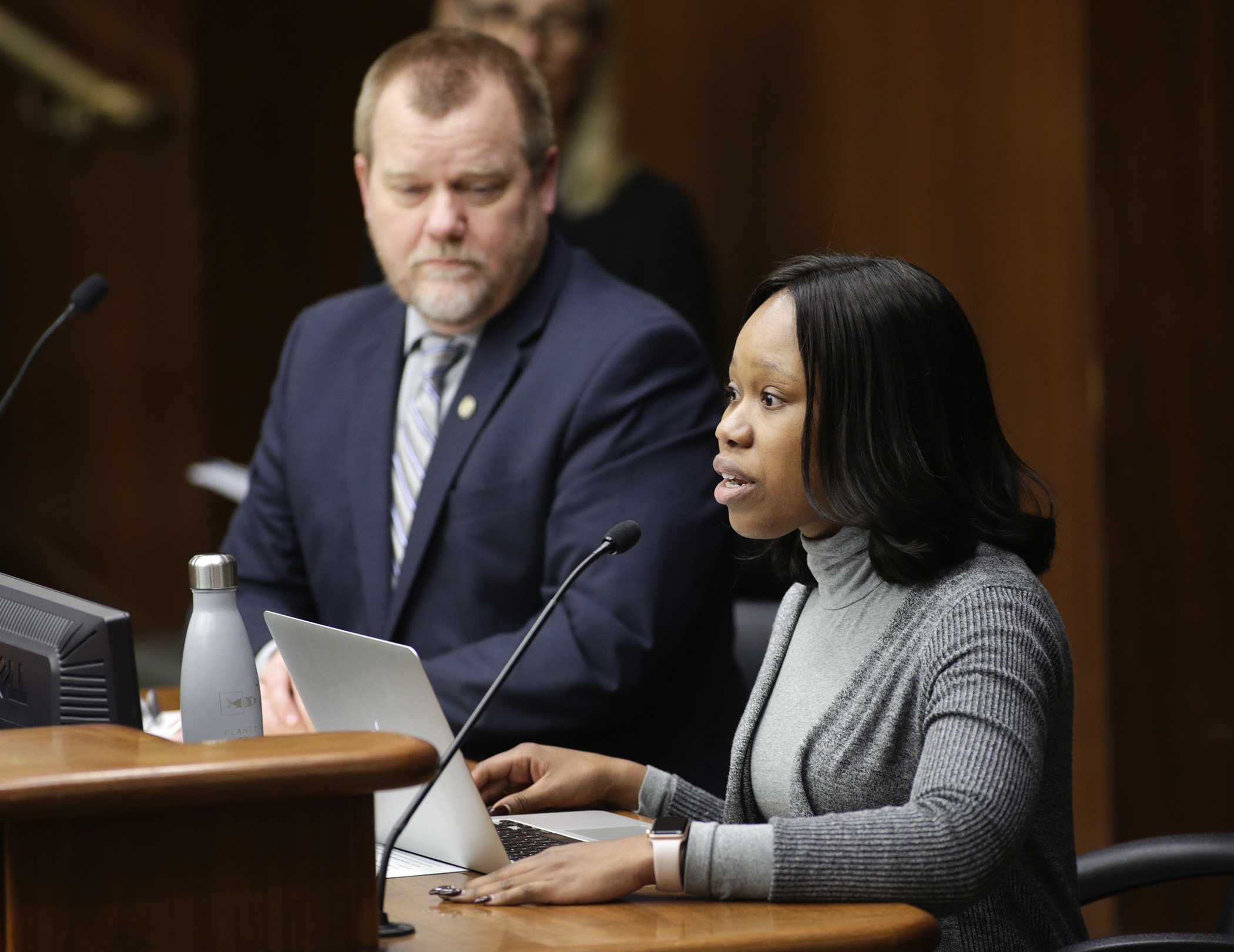 Michelle Koffa, a policy manager with EdAllies, testifies Feb. 28 before the House Education Policy Committee on HF55, sponsored by Rep. Tony Jurgens, left. Photo by Paul Battaglia