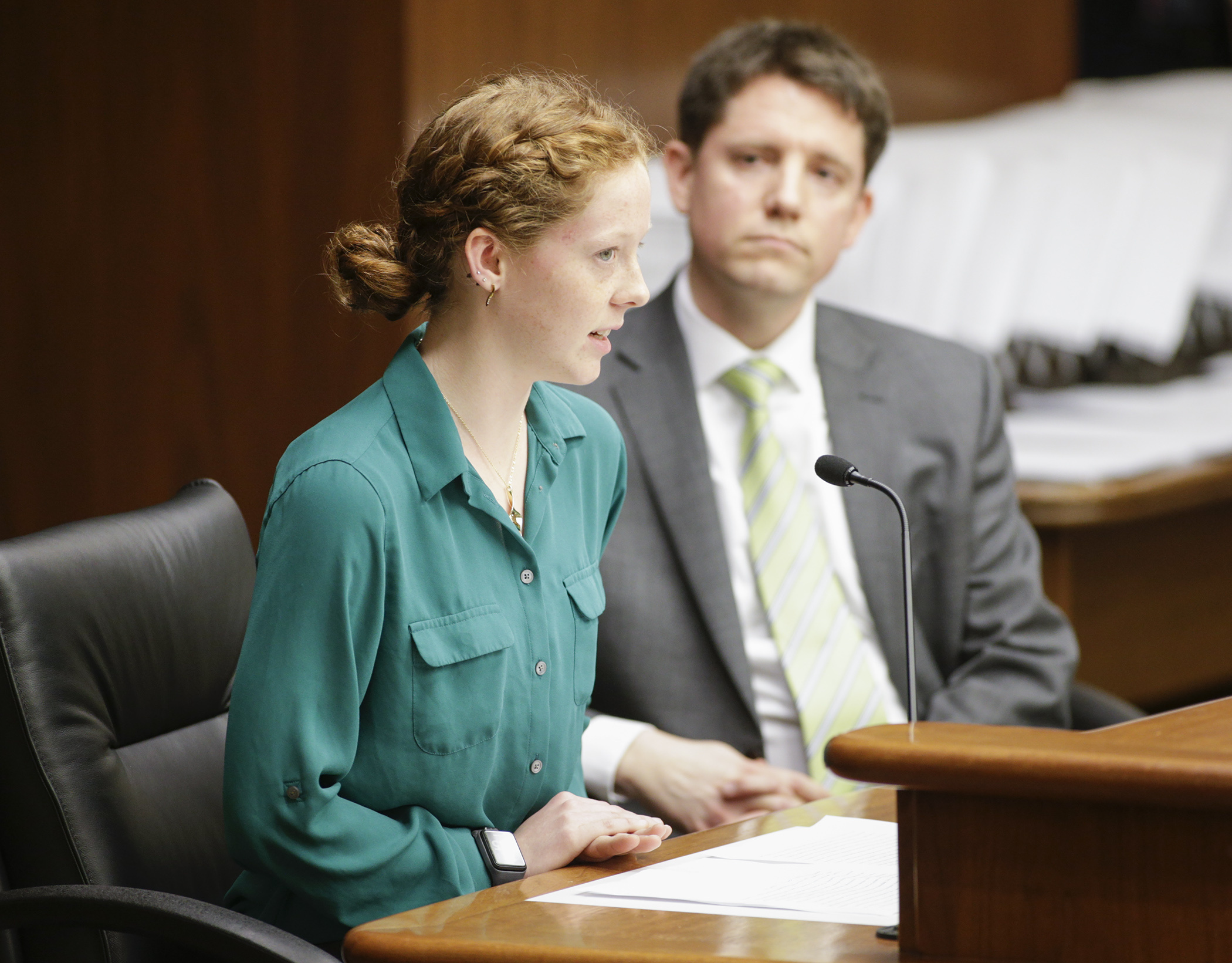 Grace Muth testifies before the House Education Policy Committee on HF1414, sponsored by Rep. Todd Lippert, right, which would, in part, require the Education Department to identify one or more model sexual health education programs. Photo by Paul Battaglia