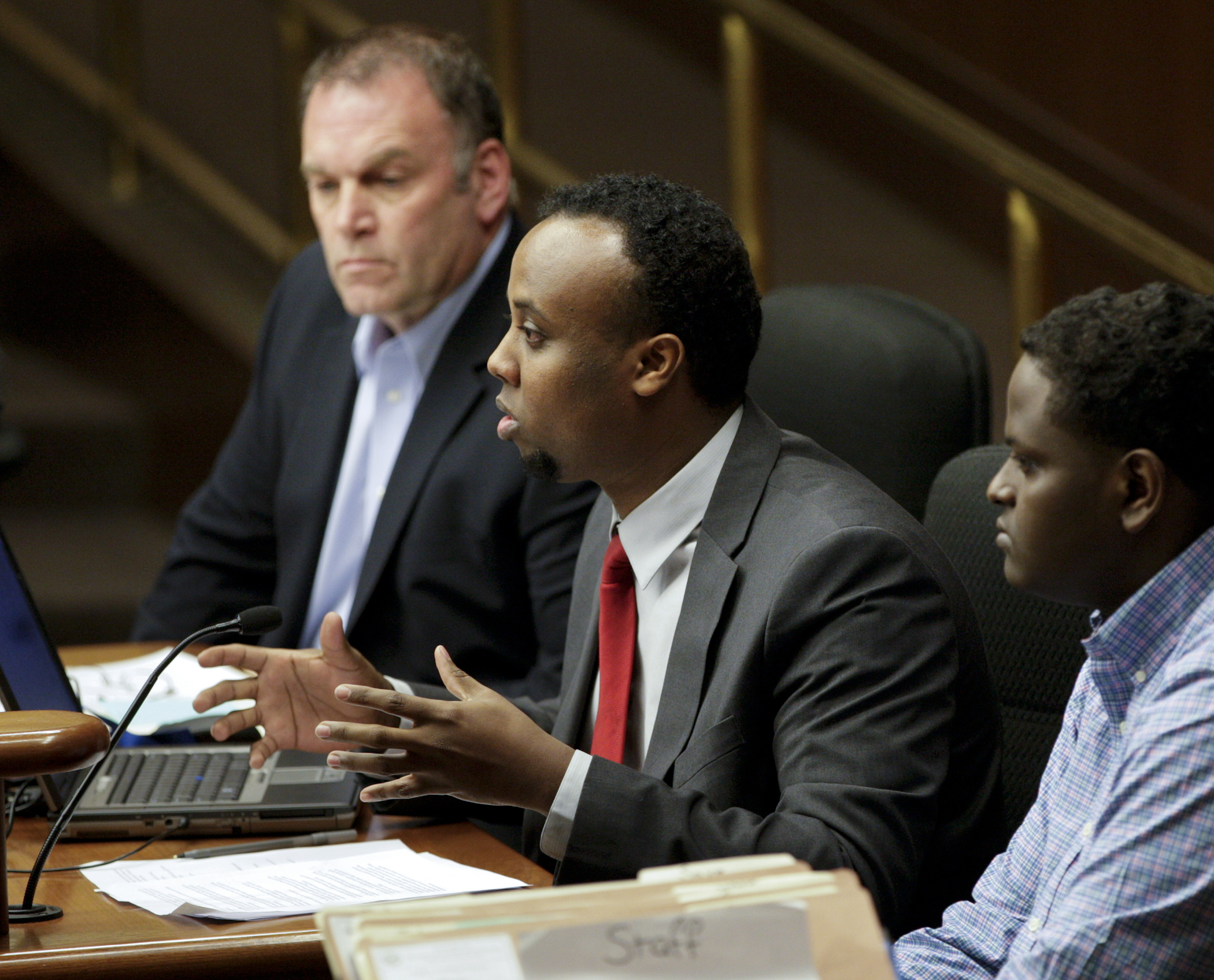 Mohamed Farah, executive director of Ka Joog, testifies March 2, in favor of HF967 that would provide funding for Somali arts and cultural heritage programs. Rep. Dave Baker, left, sponsors the bill. Photo by Paul Battaglia
