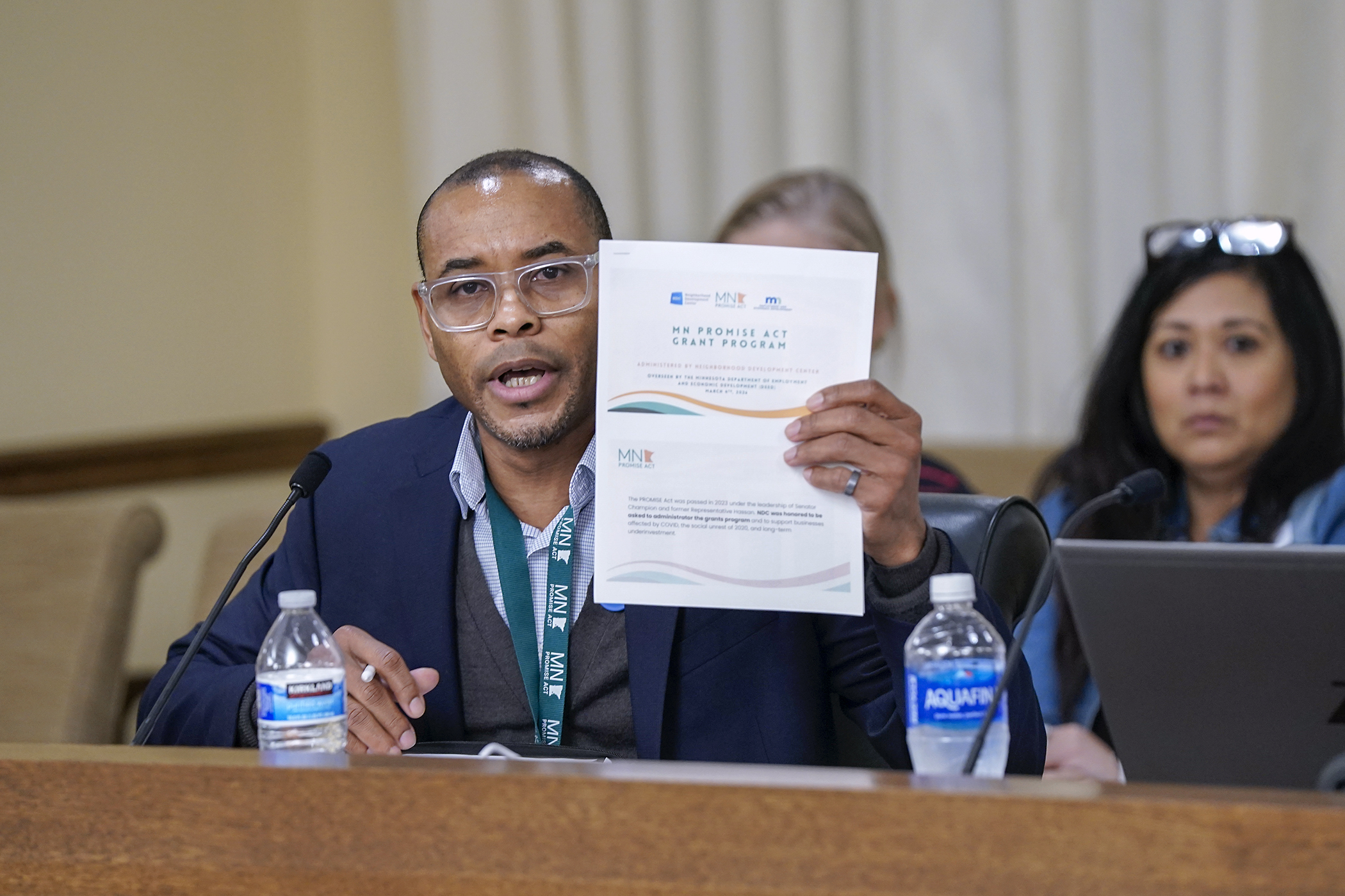 Shahir Ahmed, vice president of business services at Neighborhood Development Center, speaks before the House workforce committee March 4 during an update on the implementation of the 2023 Promise Act. (Photo by Michele Jokinen)