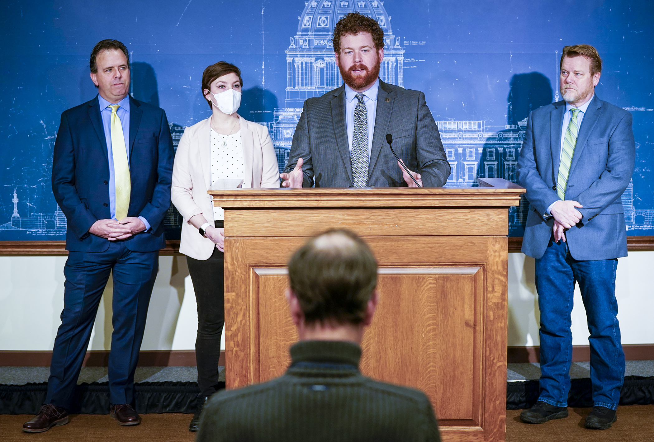 Rep. Zack Stephenson speaks during a March 7 press conference on his bill, HF778, which would legalize sports betting in Minnesota. Also attending are Rep. Pat Garofalo, from left, Rep. Carlie Kotyza-Witthuhn and Rep. Tony Jurgens. (Photo by Paul Battaglia)