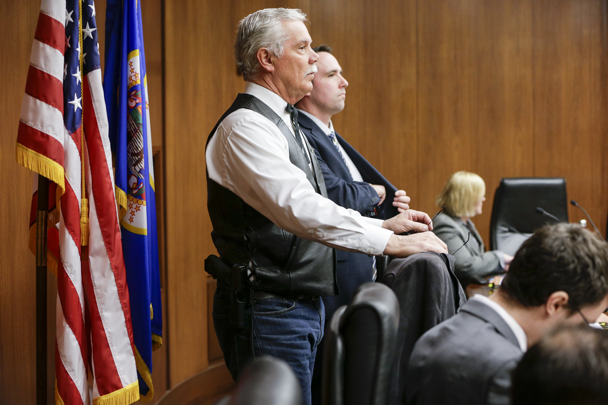 Rep. Tony Cornish, chair of the House Public Safety and Security Policy and Finance Committee, waits — with a sidearm on his hip — to begin a March 8 hearing on two gun-related bills. Photo by Paul Battaglia
