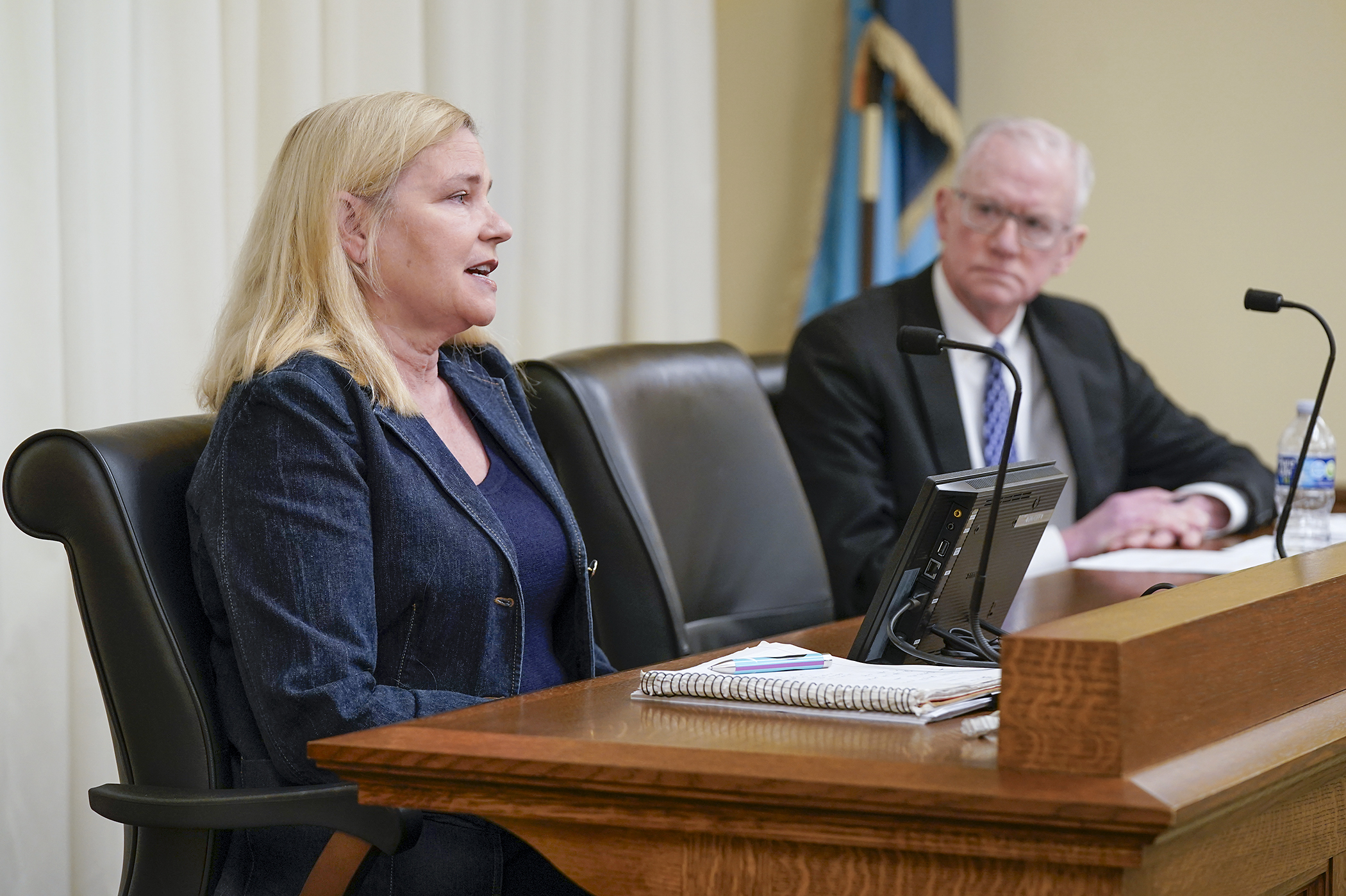 Faye Bernstein, a 20-year Department of Human Services employee, testifies March 9 before the House fraud prevention committee about retaliation she experienced after reporting contract irregularities. (Photo by Michele Jokinen)