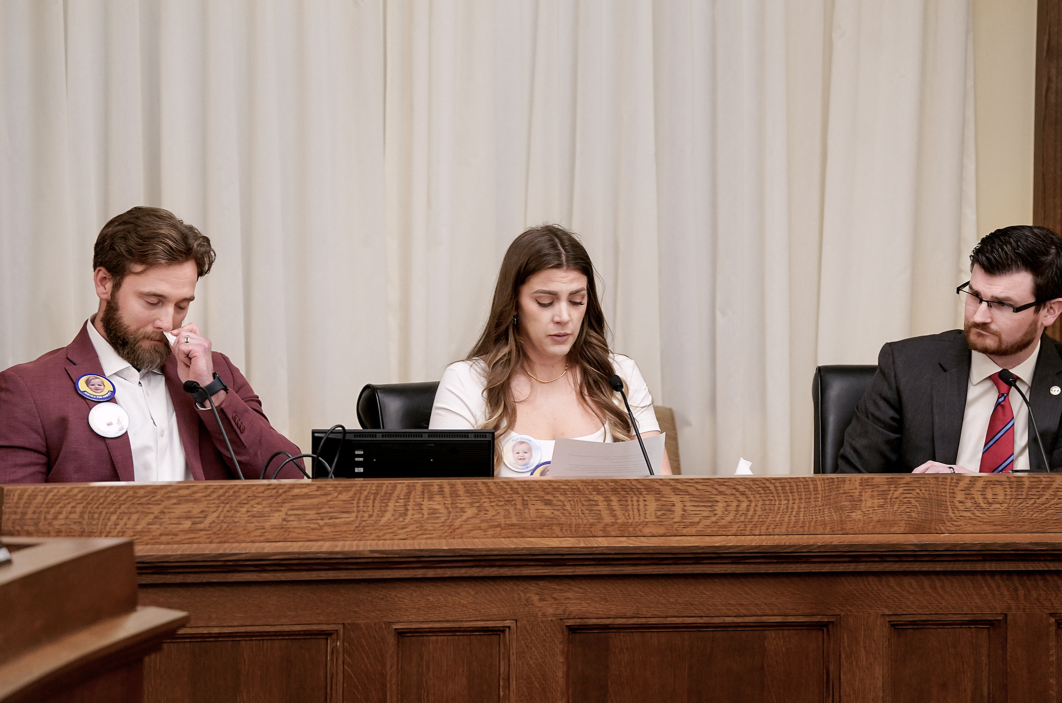 Hunter and Catherine Muklebust tearfully share the experience of the death of their infant son at his daycare during testimony on "Harvey's Law," sponsored by Rep. Nolan West, right. (Photo by Michele Jokinen)