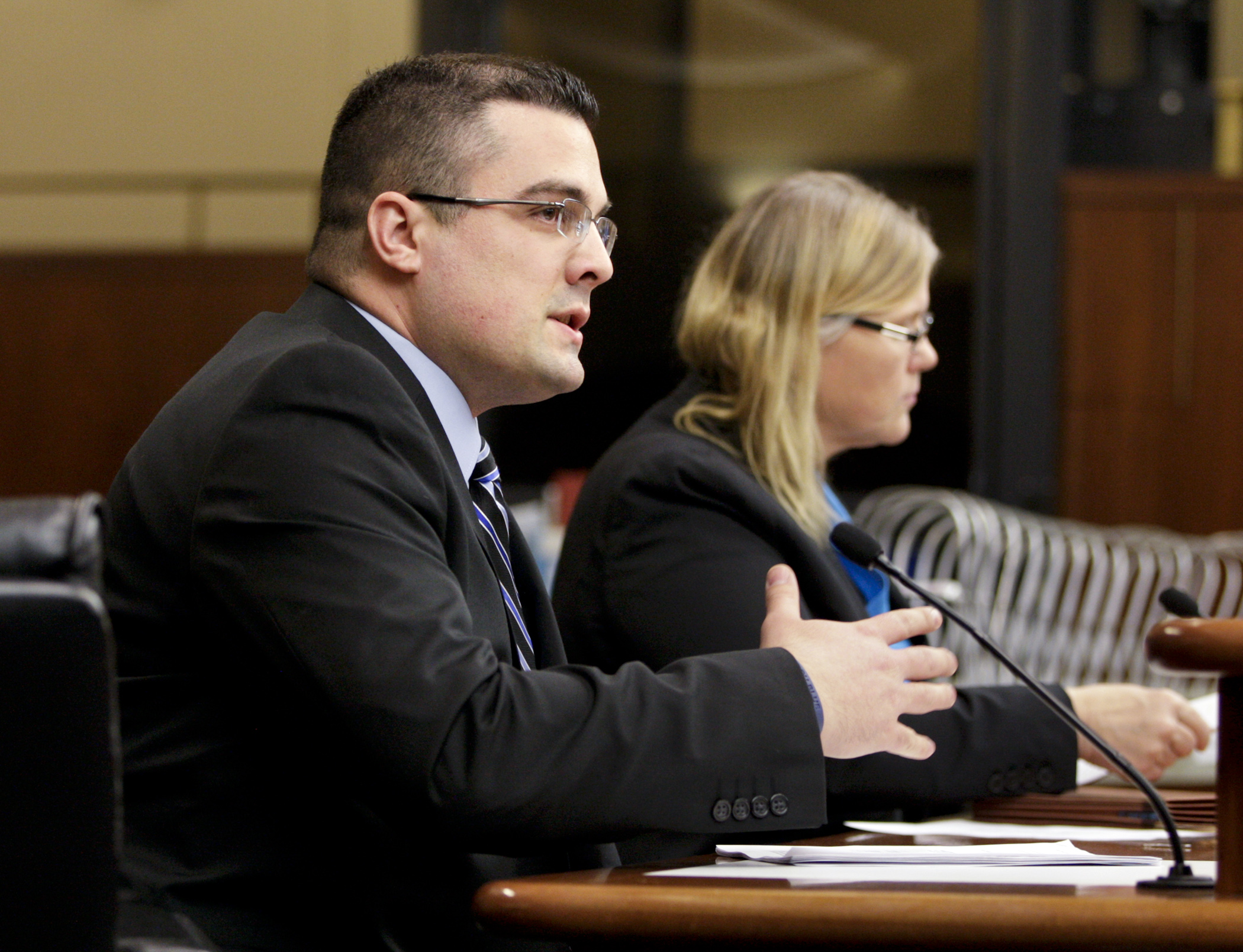 Anoka County Sheriff’s Office Detective Justin Bloch testifies March 11 in favor of HF1433, sponsored by Rep. Debra Hilstrom, right, which would prohibit video recording without consent in restrooms, locker rooms and changing rooms. Photo by Paul Battaglia