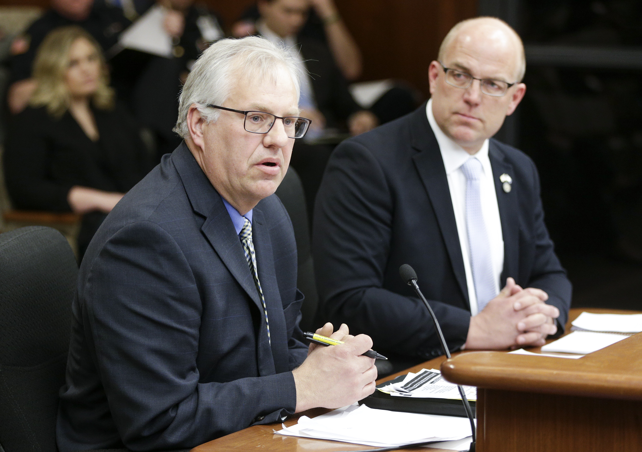 Swift County Commissioner Gary Hendrickx testifies before the House State Government Finance Committee on a bill sponsored by Rep. Tim Miller, right, to provide funding to acquire the Prairie Correctional Facility in Appleton. Photo by Paul Battaglia