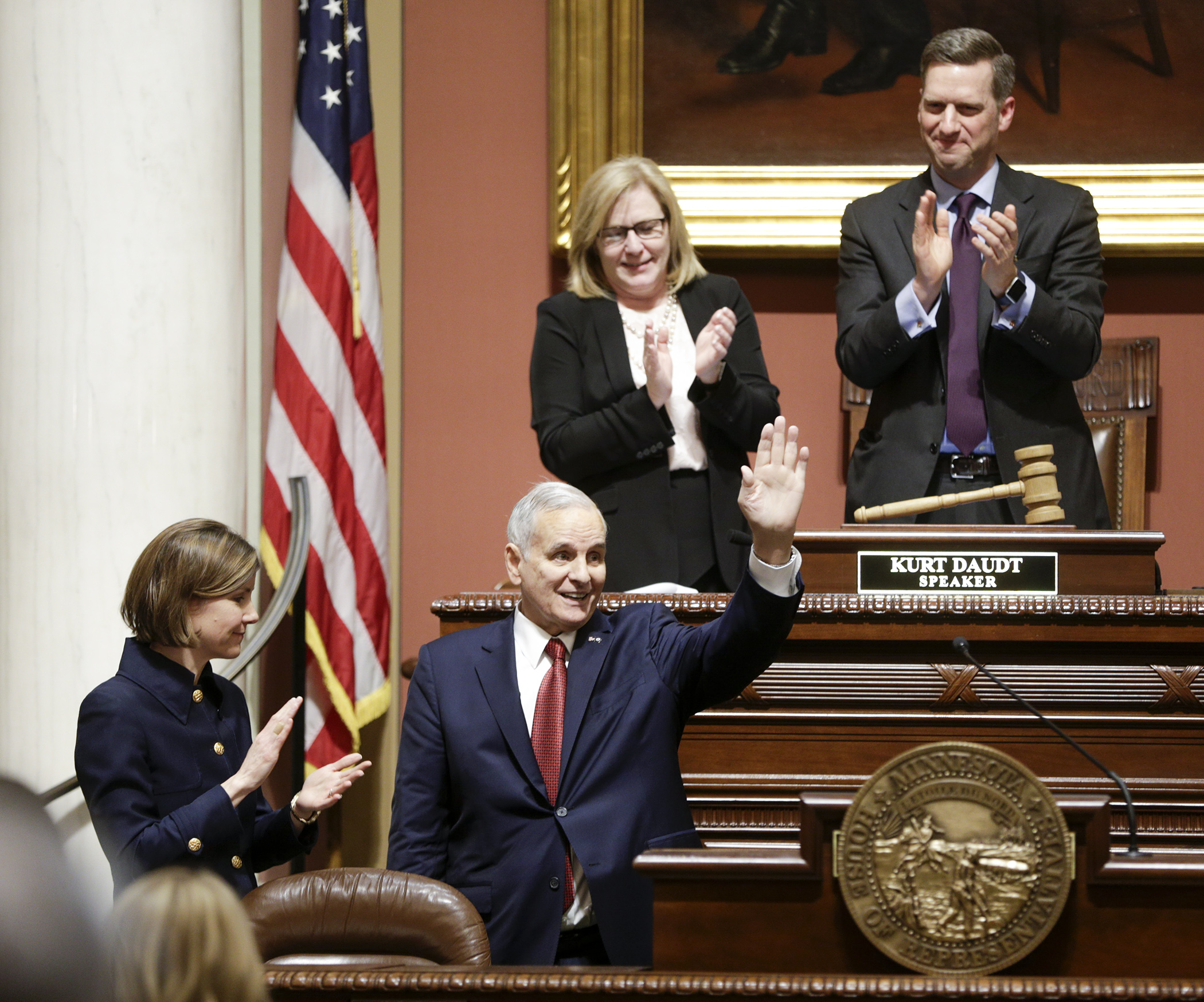 Gov. Mark Dayton waves Wednesday night after finishing his State of the State Address in the House Chamber. Photo by Paul Battaglia