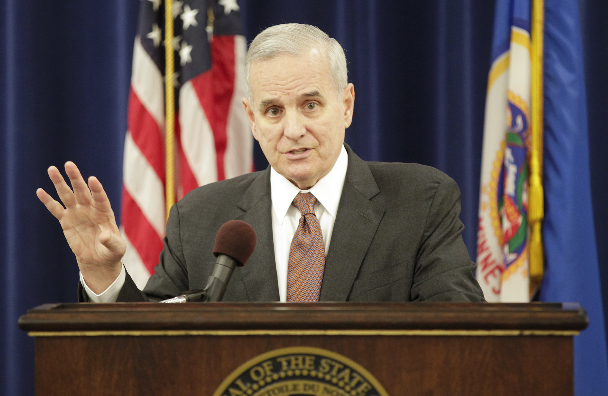 Gov. Mark Dayton outlines his 2016 supplemental budget proposal at a March 15 news conference. The proposal includes additional spending on broadband, pre-k and clean water. Photo by Paul Battaglia