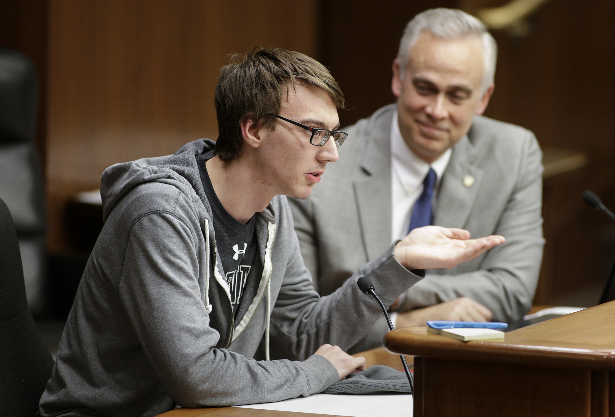 Holden Stafford tells the House Higher Education and Career Readiness Policy and Finance Committee March 15 about his experience with the Occupational Skills Program at Ridgewater College in Willmar. Rep. Tony Albright, right, presented HF2153 which would, in part, require a state university program for students with intellectual and developmental disabilities. Photo by Paul Battaglia