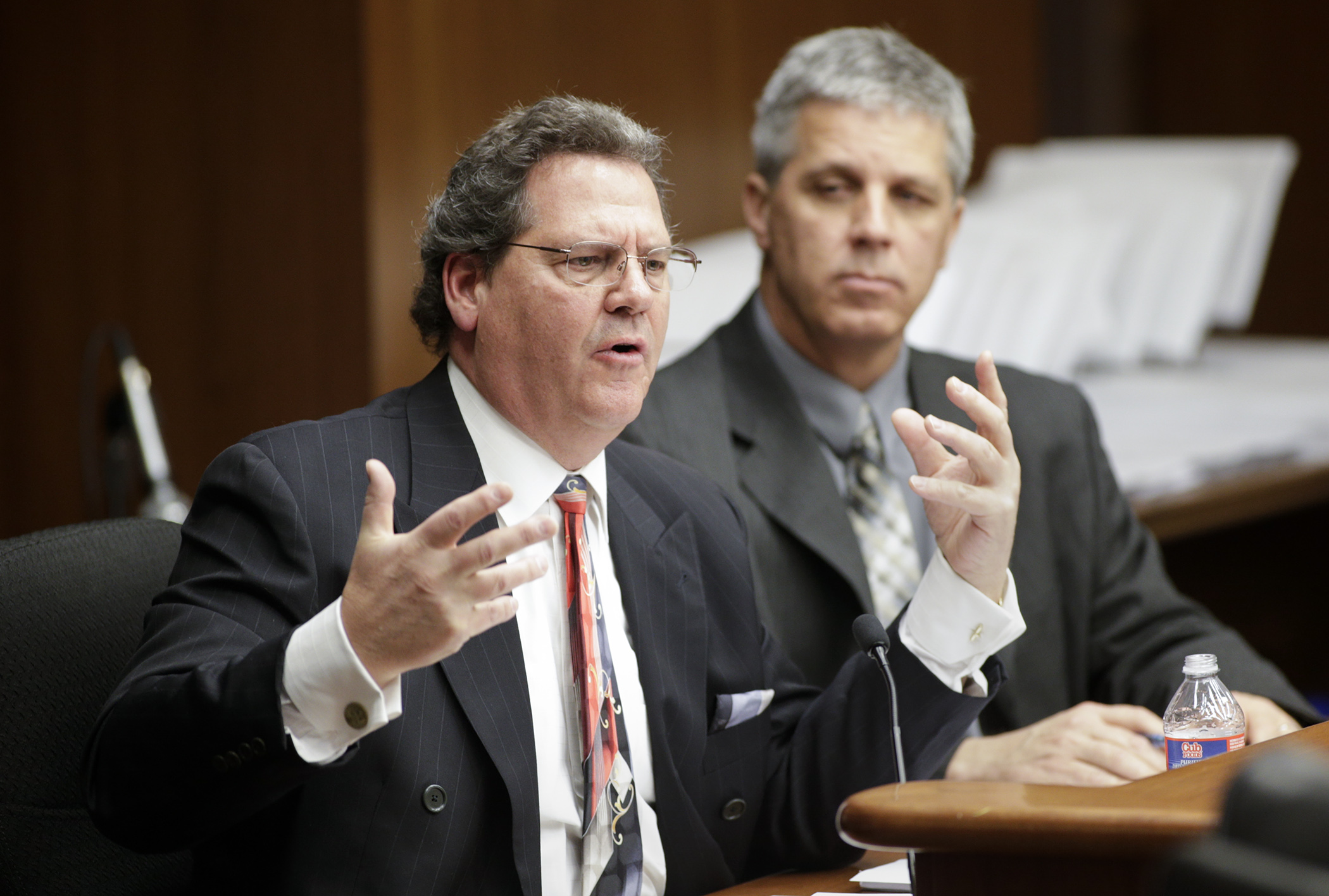 Dan Pilla, director of the Tax Freedom Institute, testifies March 15 before the House Taxes Committee in favor of a bill sponsored by Rep. Steve Drazkowski (R-Mazeppa), right. Photo by Paul Battaglia