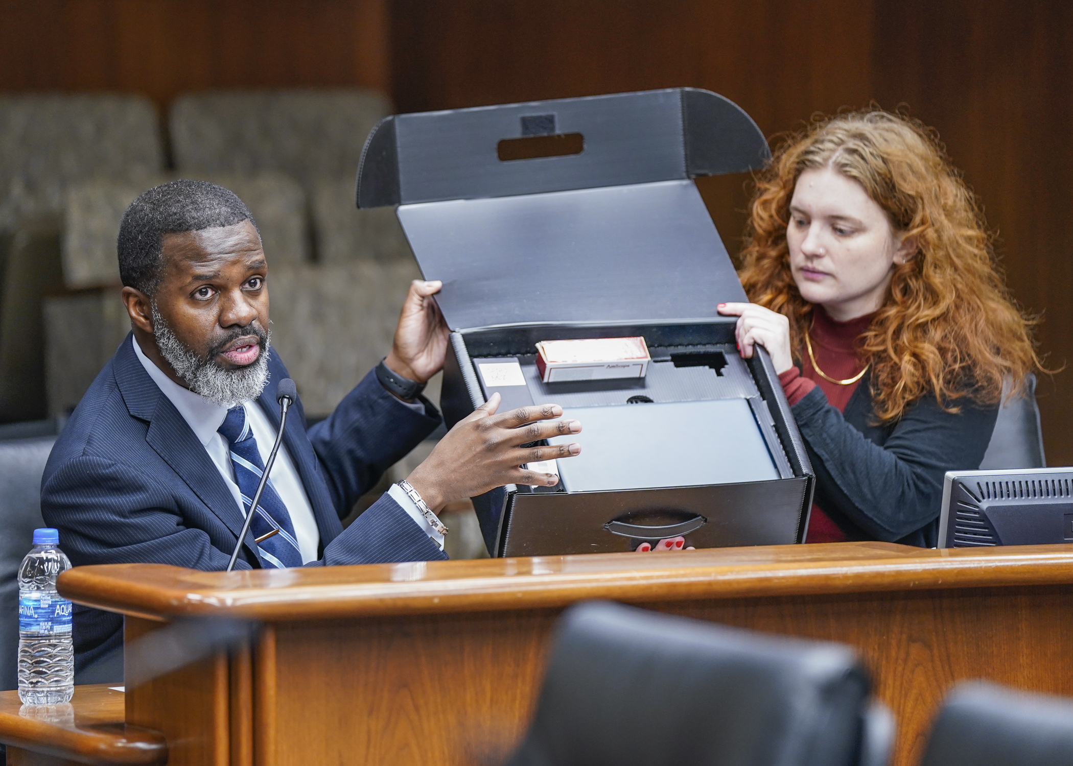 With the help of Rep. Sydney Jordan, Eric Black, president and CEO of Minnesota Diversified Industries, shows a STEM box that is designed to help individuals with disabilities find and secure employment. (Photo by Catherine Davis)
