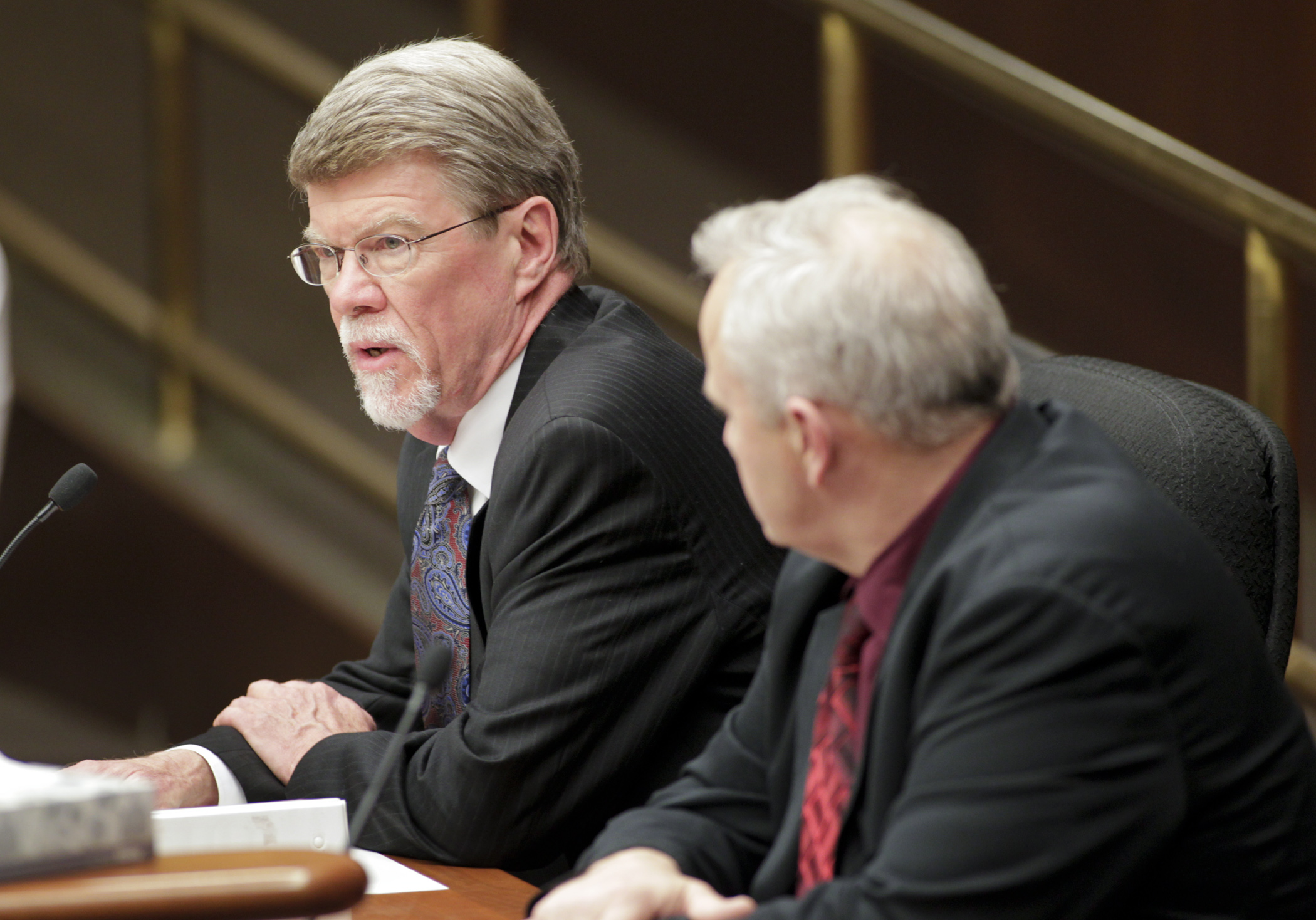 Legislative Auditor Jim Nobles, left, answers a members question during testimony on HF462, sponsored by Rep. Steve Green, right, which would modify the eligibility for Legacy fund appropriations. Photo by Paul Battaglia