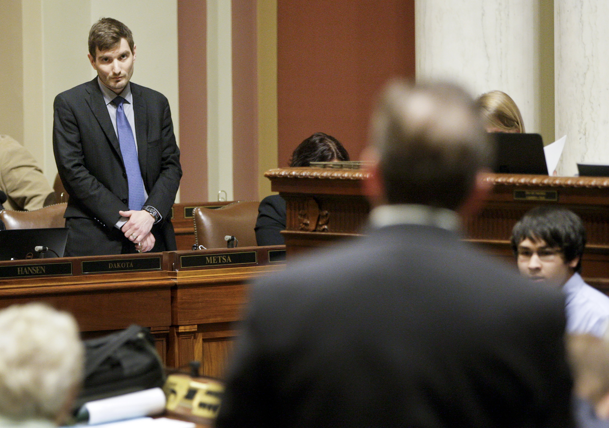 Rep. Jason Metsa, left, listens to Rep. Pat Garofalo during debate on SF209 during session March 17. The bill passed 104-25. Photo by Paul Battaglia