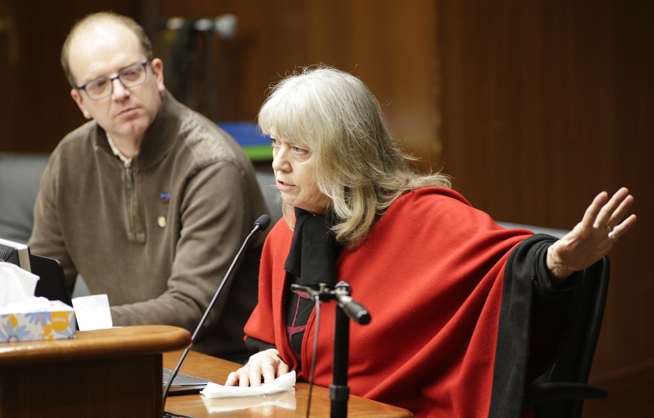 Farmer/rancher Mary Falk testifies March 19 in support of HF1630, sponsored by Rep. Brad Tabke, left, which would establish a pilot program to provide grants to prevent wolf-livestock conflict. Photo by Paul Battaglia