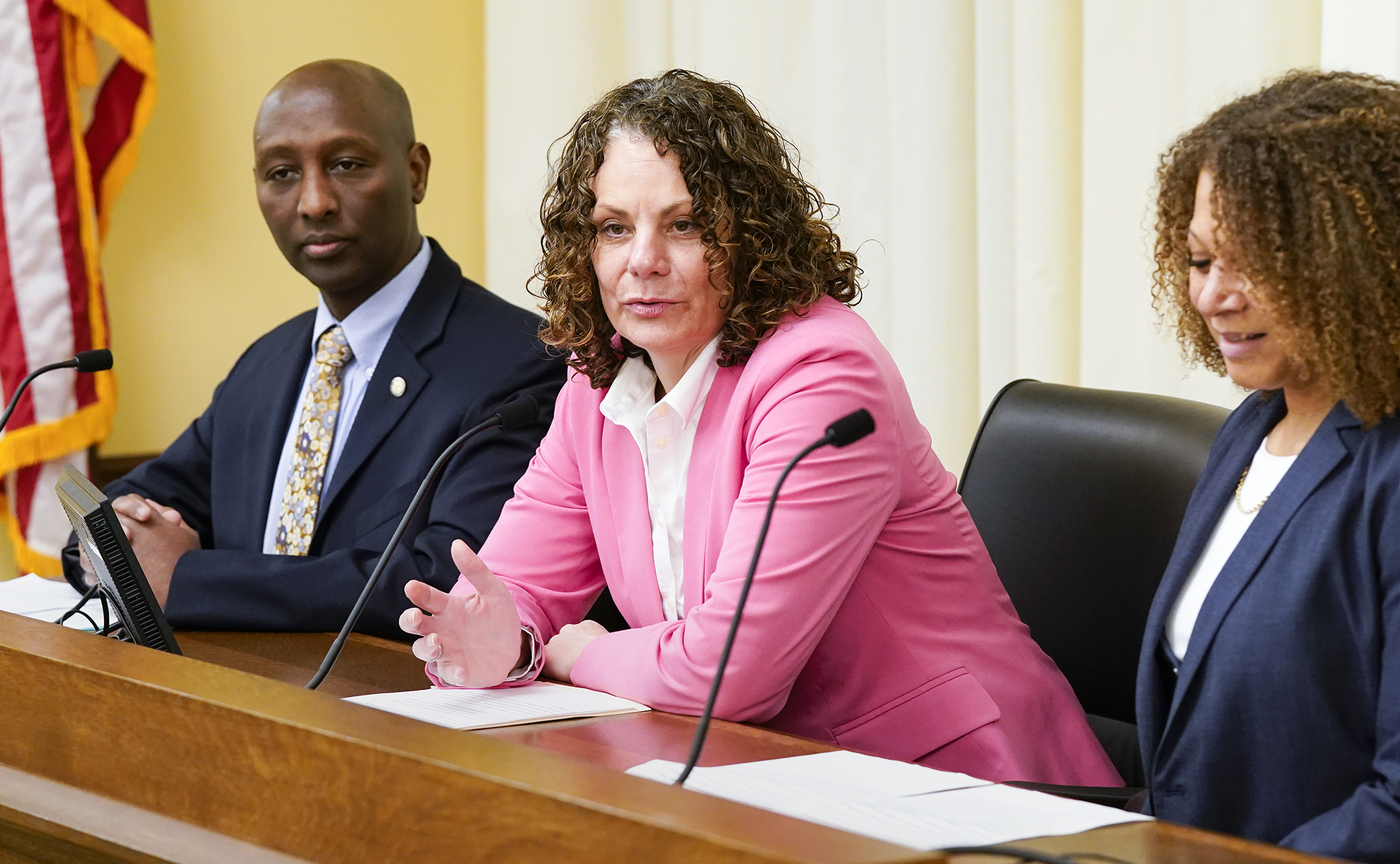 Elena Gaarder, chief executive officer for the Metropolitan Consortium of Community Developers, testifies on HF3733 during the first House hybrid committee meeting March 21. The bill is sponsored by Rep. Mohamud Noor, left. (Photo by Paul Battaglia)