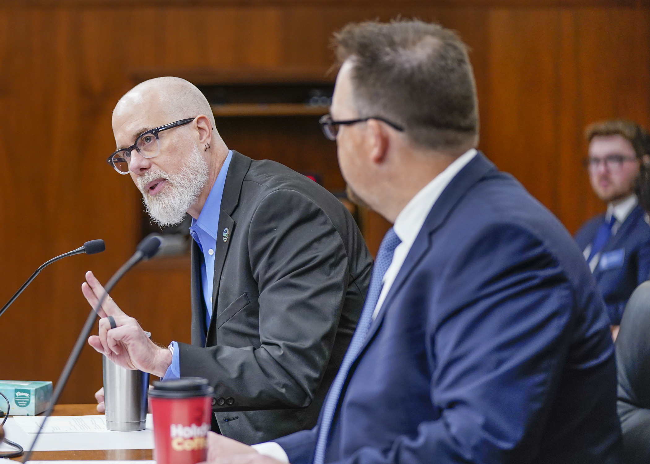 Mark Grant, legislative committee chair for Minnesota State College Faculty, fields a question from a member the House Higher Education Finance and Policy Committee March 21. (Photo by Catherine Davis)