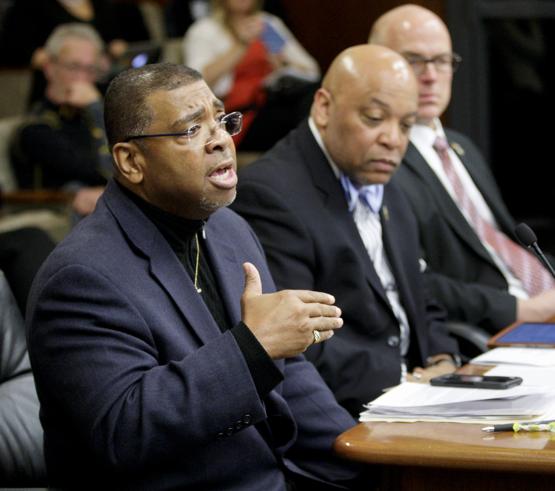 The Rev. Brian Herron of Zion Baptist Church in Minneapolis speaks March 22 to the House Public Safety and Crime Prevention Policy and Finance Committee against HF3223, a bill that would permit housing state prisoners in privately owned facilities. Photo by Paul Battaglia