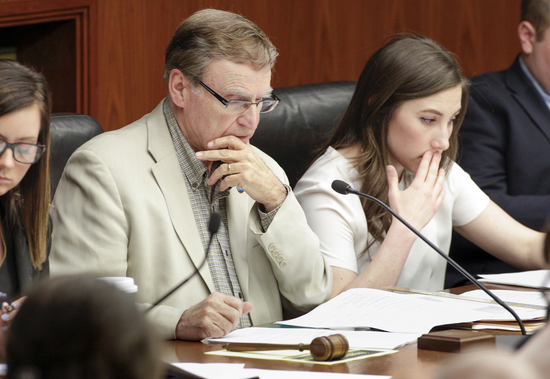 Rep. Bud Nornes, chair of the House Higher Education and Career Readiness Policy and Finance Committee, and Committee Legislative Assistant Megan Hennen follow along as staff review provisions of the committee’s omnibus bill March 22. Photo by Paul Battaglia